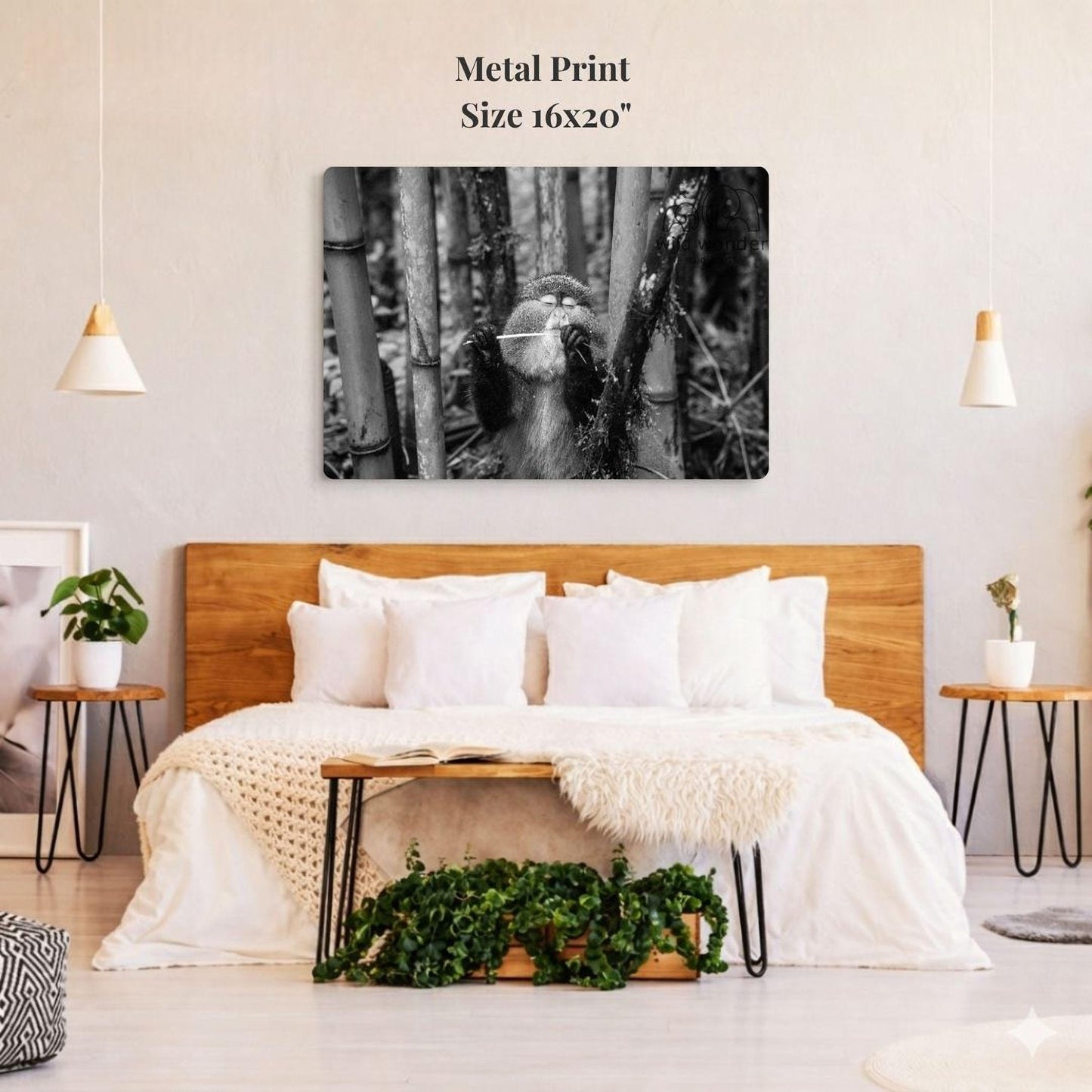 a bedroom with a large bed, wooden headboard, and a potted plant on a nightstand. Above the bed, there is a large black and white photograph of a bamboo tree with a bird perched on it. The room has a minimalist and modern design, with white walls and a wooden floor.