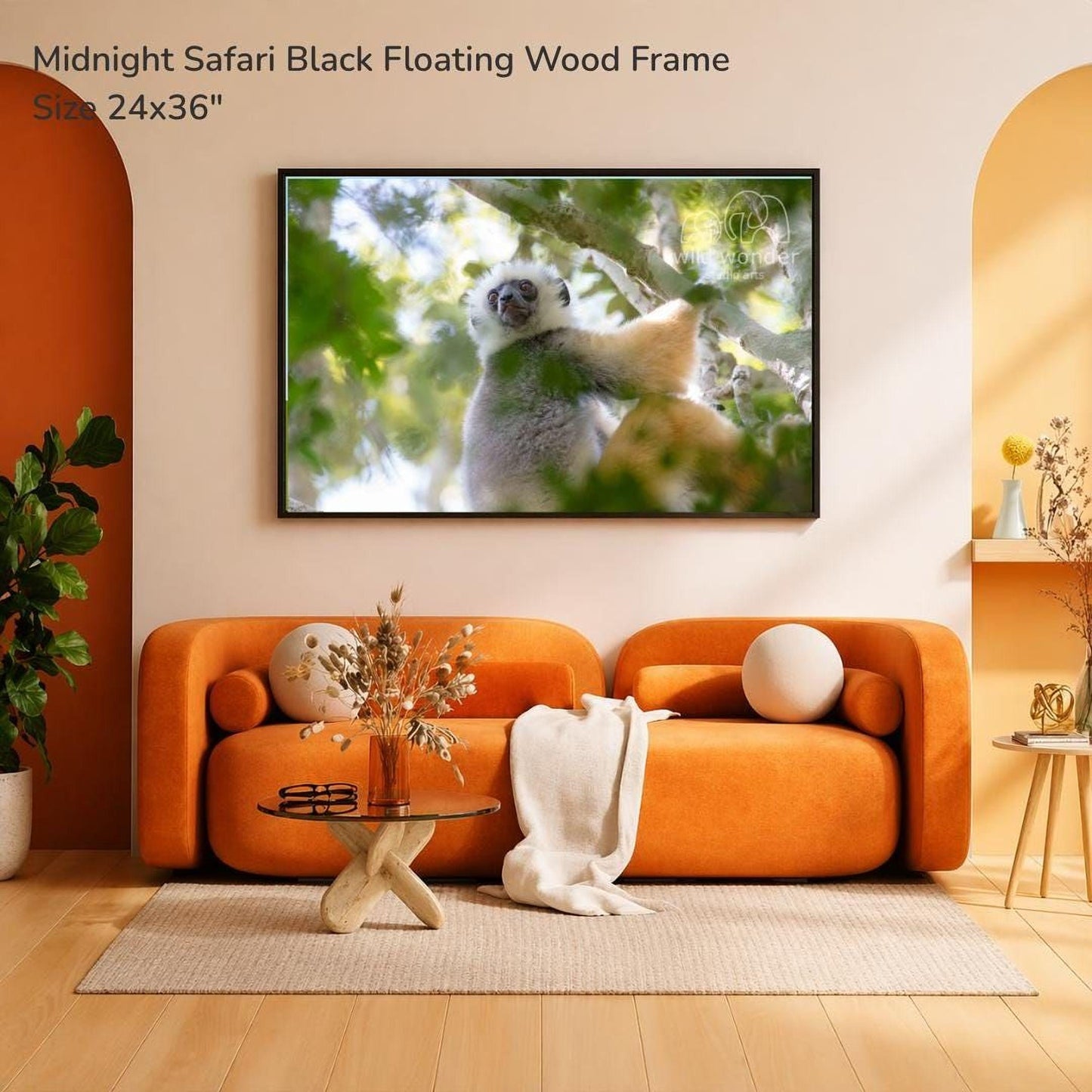 a cozy living room with an orange sofa, a glass coffee table, and a framed photograph of a lemur hanging on the wall.
