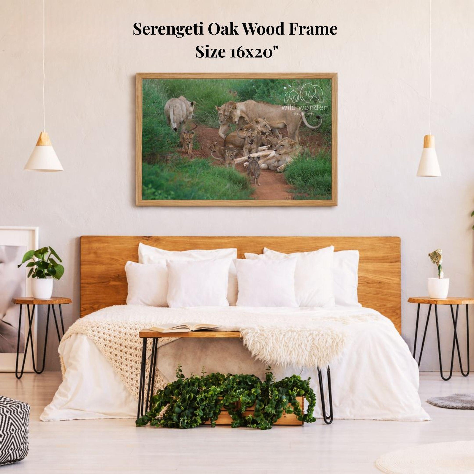 a serene bedroom scene with a large wooden bed, a wooden headboard, and a framed picture of a group of animals on the wall above the bed.