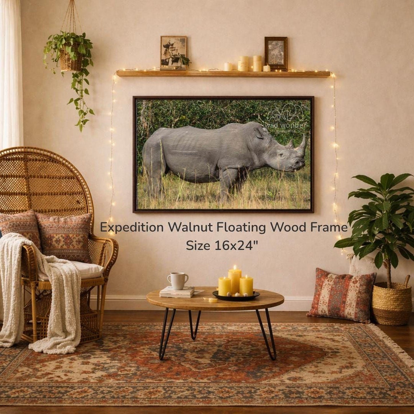 a large, 16x24" walnut floating wood frame hanging on a wall, with a photograph of a rhinoceros displayed on it. The room has a cozy, rustic atmosphere with a wicker chair, a coffee table, and various decorative elements such as plants and candles.