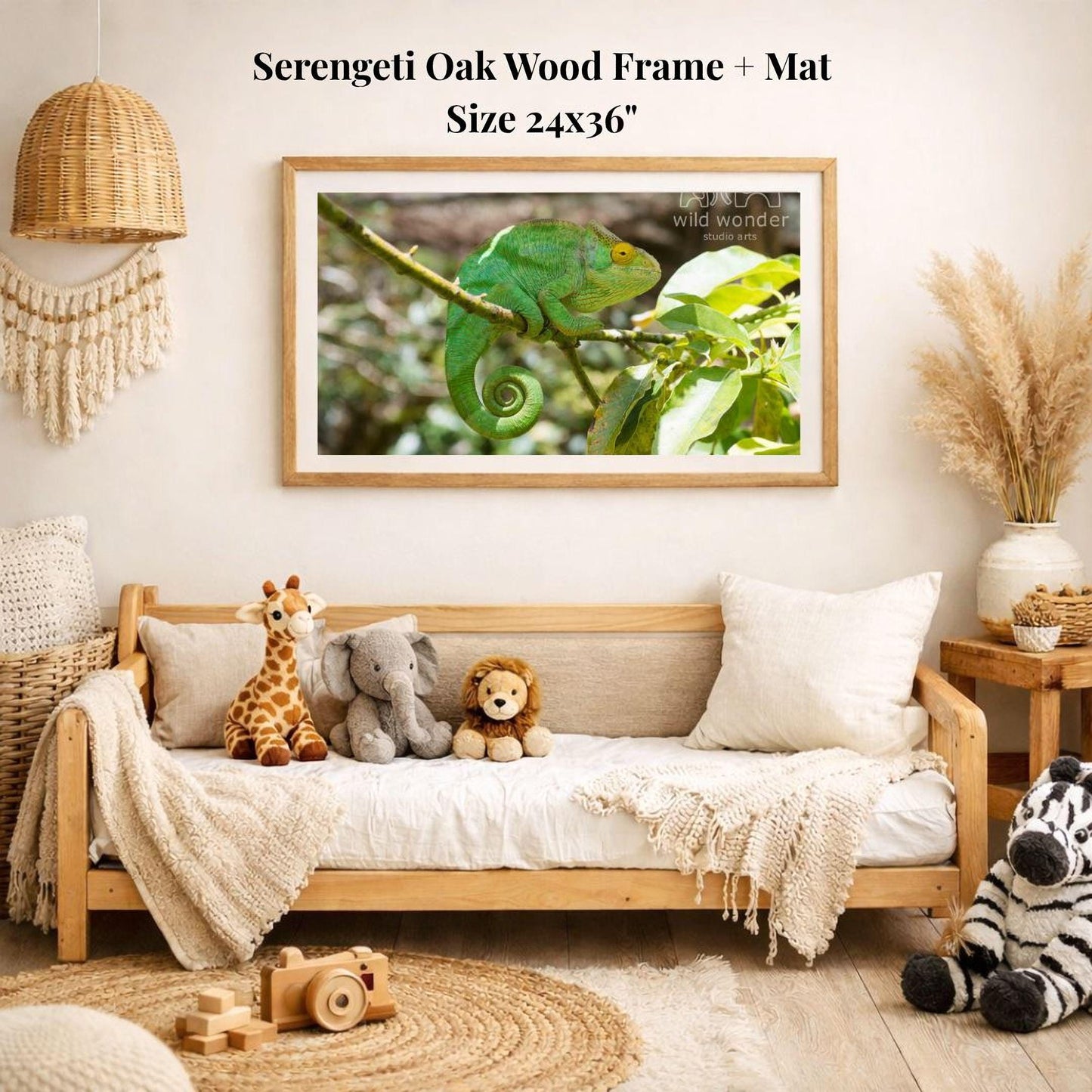 a serene indoor setting with a wooden frame and mat hanging on a wall, displaying a photograph of a chameleon on a branch. The frame is surrounded by various stuffed animals, including a giraffe, elephant, lion, and zebra, creating a cozy and playful atmosphere.
