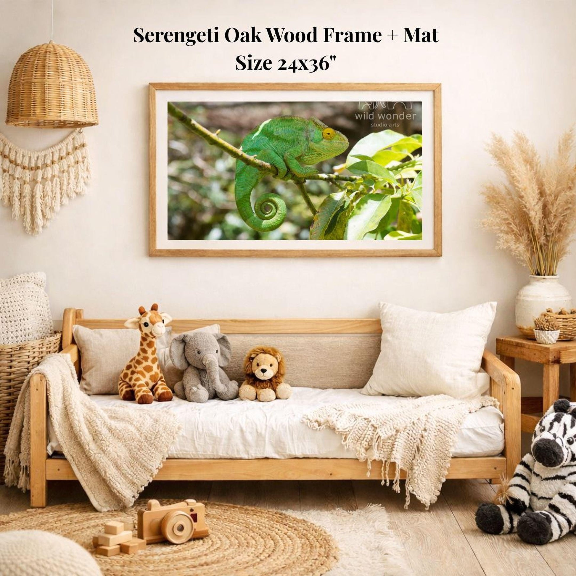 a serene indoor setting with a wooden frame and mat hanging on a wall, displaying a photograph of a chameleon on a branch. The frame is surrounded by various stuffed animals, including a giraffe, elephant, lion, and zebra, creating a cozy and playful atmosphere.