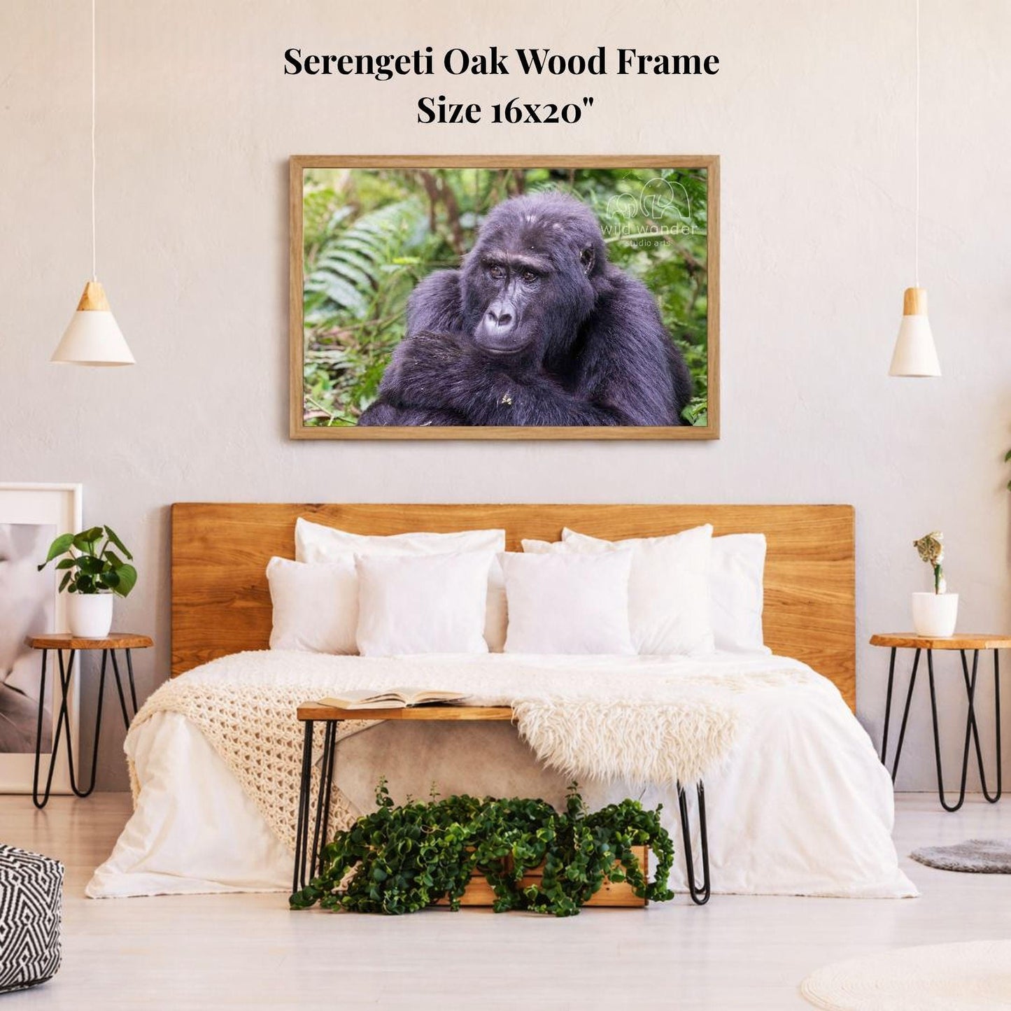 a serene bedroom setting with a large framed photograph of a gorilla hanging on the wall above a bed with white bedding.