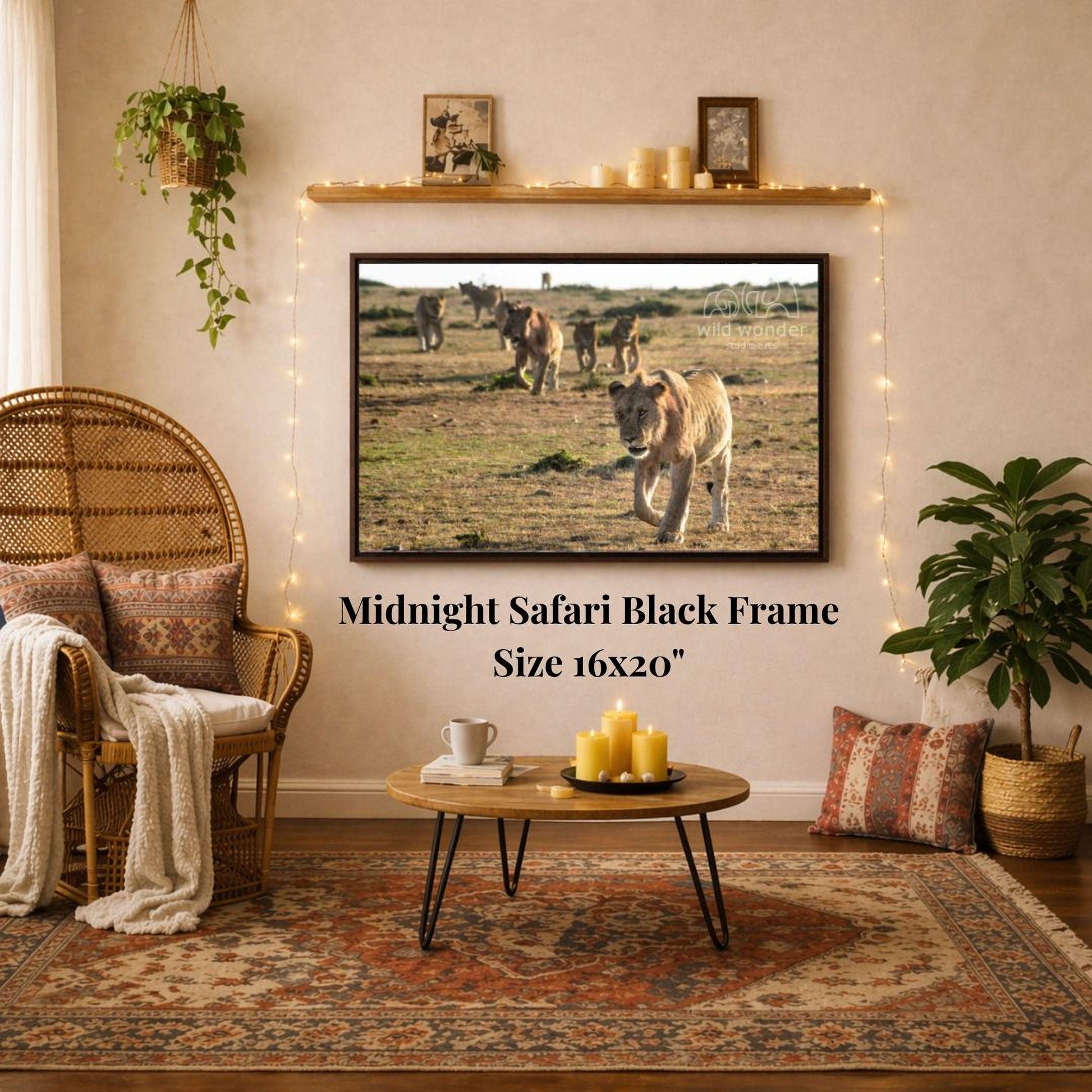 a living room with a large framed photograph of a group of lions on the wall, a wicker chair, a coffee table, and a potted plant.