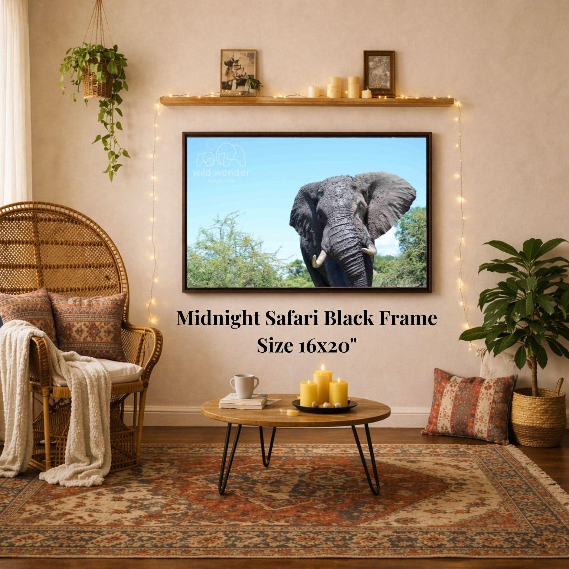 a living room with a large framed picture of an elephant on the wall, a wicker chair, a coffee table, and a potted plant.