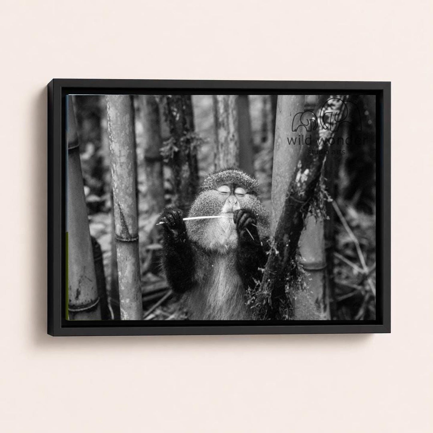 A monkey is standing in a forest, holding a stick in its hands.