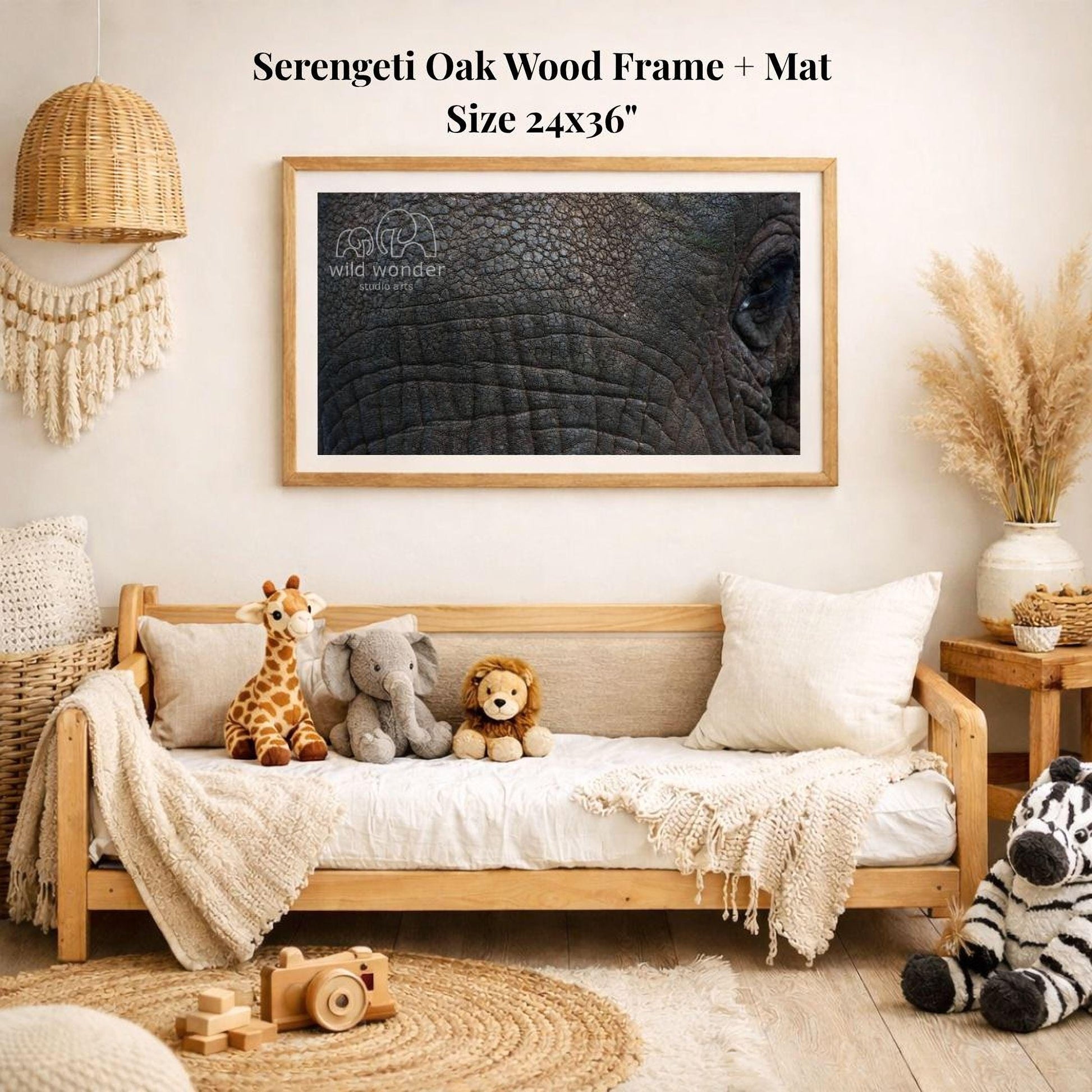 a serene and cozy living room with a large framed photograph of an elephant's eye hanging on the wall. The room is decorated with various stuffed animals, including a giraffe, an elephant, and a lion, arranged on a couch and a bed. The room also has a woven basket, a wooden chair, and a potted plant, creating a warm and inviting atmosphere.