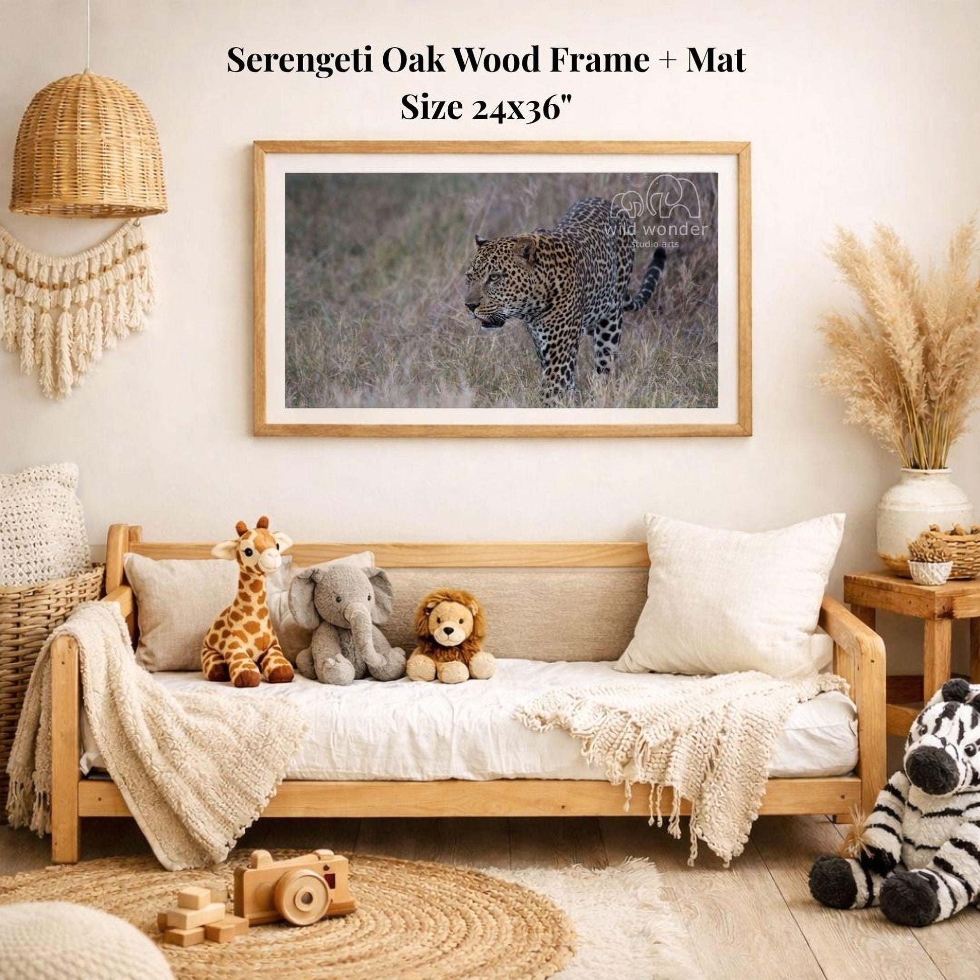 a serene indoor setting with a wooden frame and mat hanging on the wall, displaying a photograph of a leopard in the wild. The frame is surrounded by various stuffed animals, including a giraffe, an elephant, and a lion, creating a cozy and playful atmosphere.