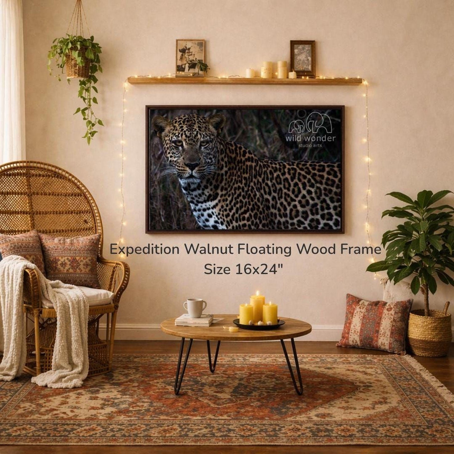 a large wall-mounted 16x24" walnut floating wood frame with a leopard print design, hanging above a coffee table with candles and a book. The room has a cozy and inviting atmosphere, with a wicker chair, a woven rug, and a potted plant.