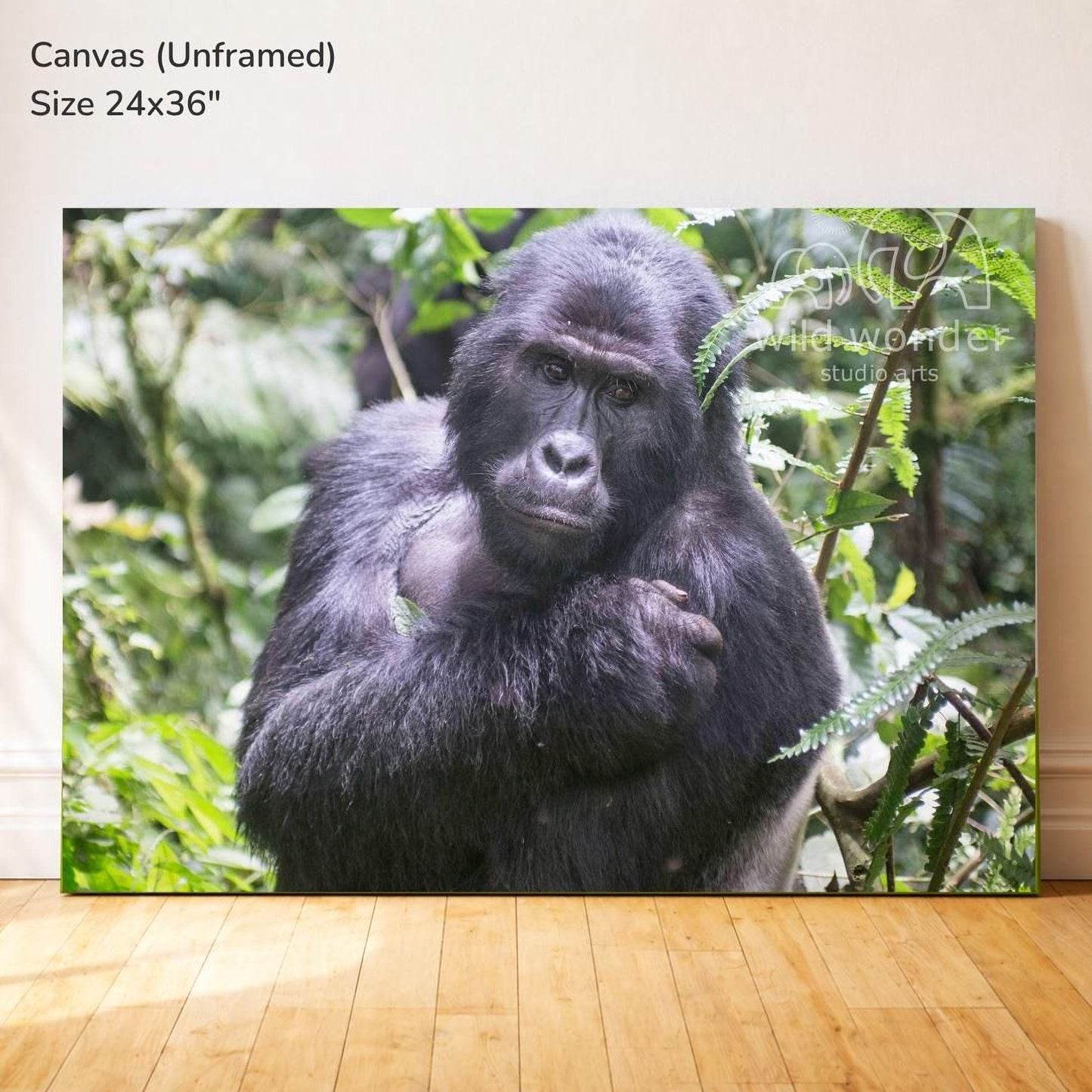 A large canvas print depicting a close-up of a gorilla in a lush, green forest environment.