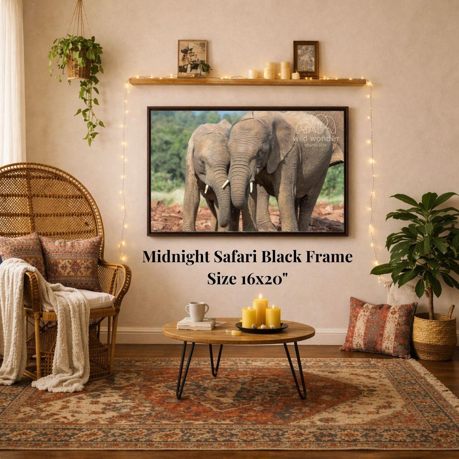 a living room with a large framed photograph of two elephants on the wall, a wicker chair, a coffee table, and a potted plant.