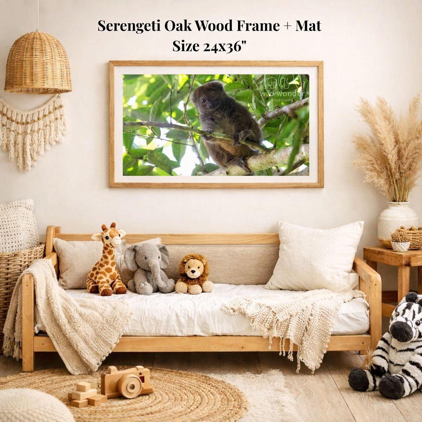 a serene indoor setting with a wooden frame and mat hanging on a wall, displaying a photograph of a koala bear sitting on a branch. The frame is surrounded by various stuffed animals, including a giraffe, an elephant, and a lion, creating a cozy and playful atmosphere.