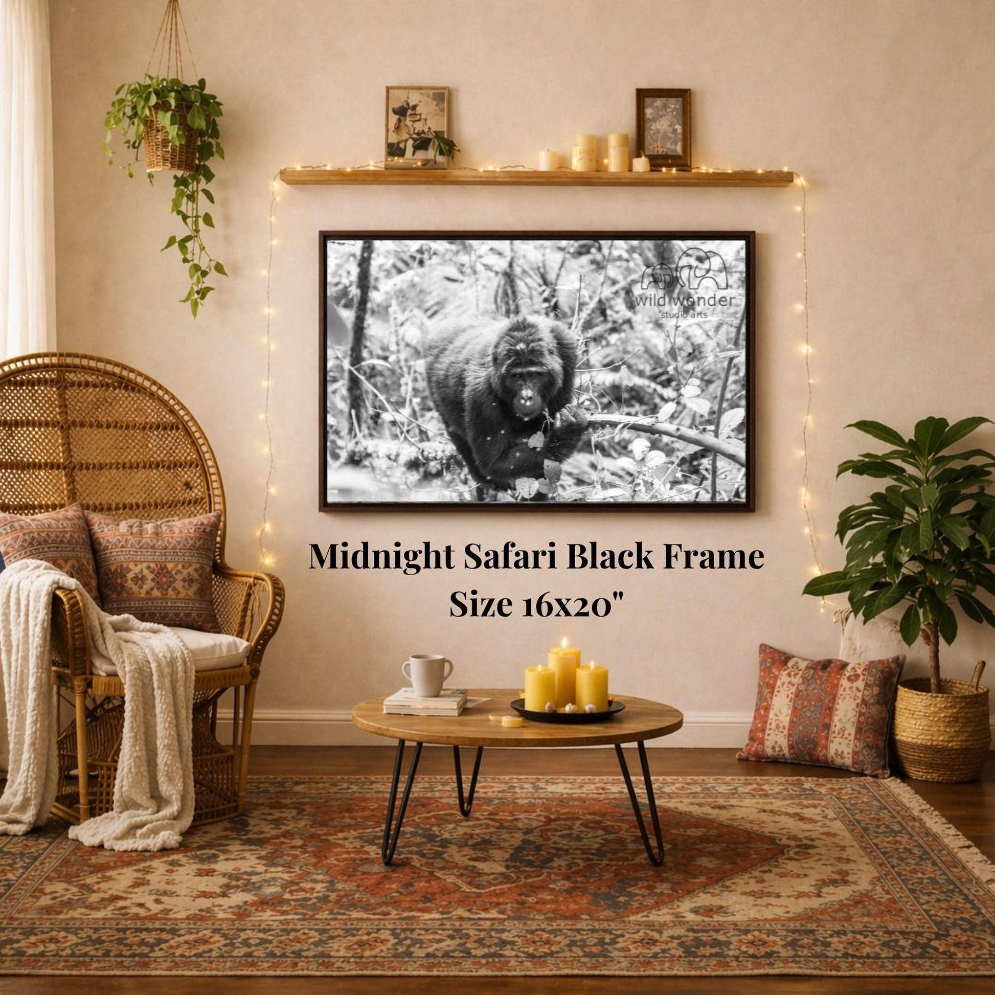 a cozy living room with a large black and white photograph of a gorilla hanging on the wall. The room is decorated with a wicker chair, a coffee table, and a potted plant. The photograph is framed in a 16x20" size, and the text "Midnight Safari Black Frame" is displayed below the frame.