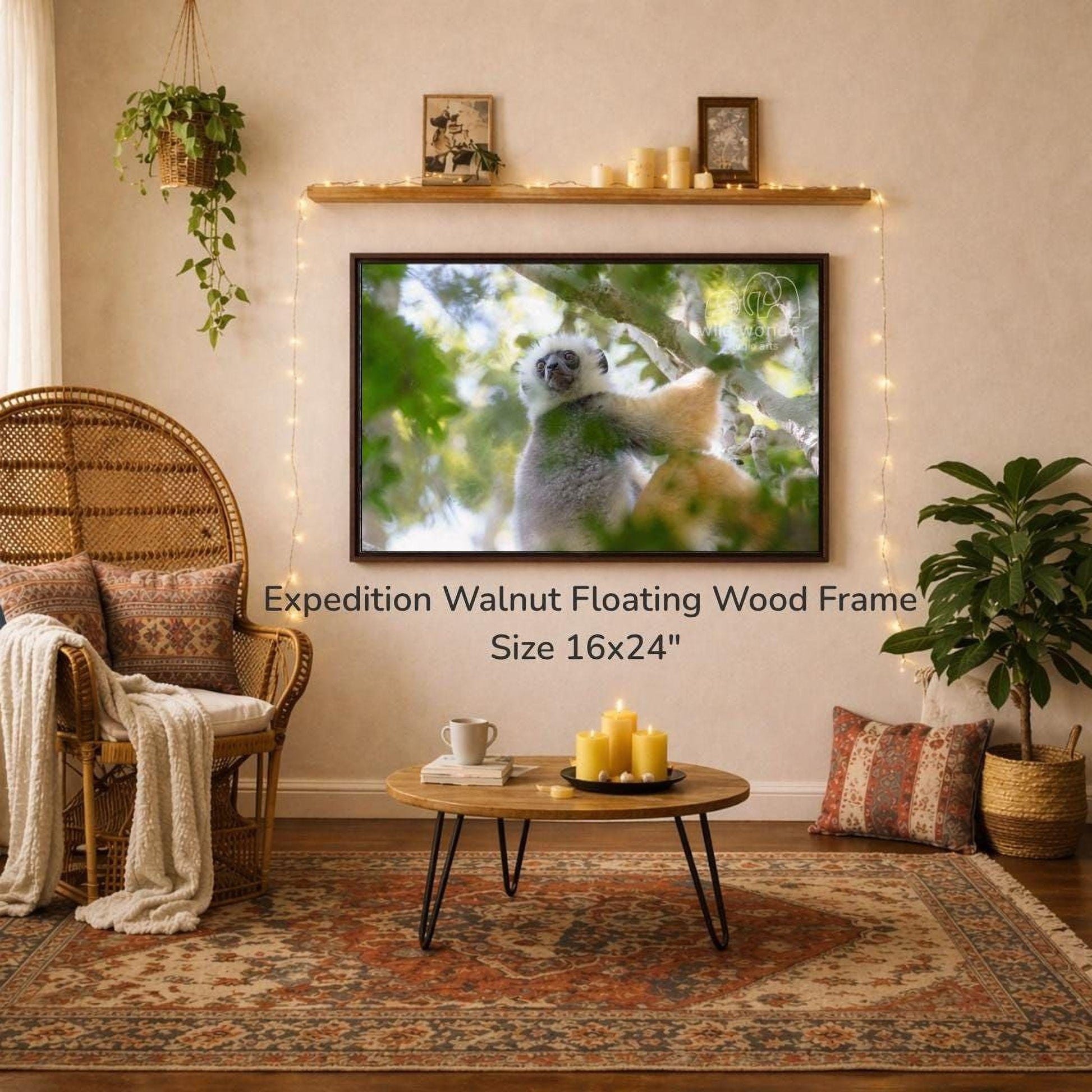 a cozy living room with a large 16x24" walnut floating wood frame hanging on the wall, a wicker chair, a coffee table with candles, and a potted plant.