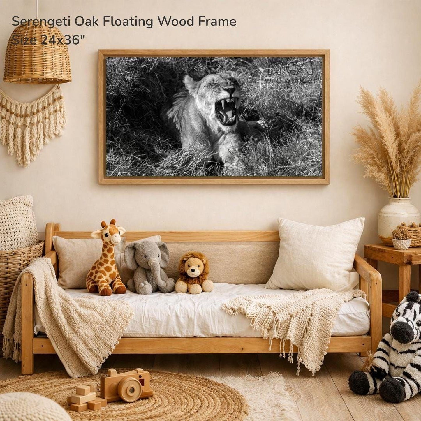 a serene indoor setting with a wooden frame hanging on a wall, displaying a black and white photograph of a lioness in a grassy field. The frame is surrounded by various stuffed animals, including a giraffe, an elephant, and a lion, creating a cozy and playful atmosphere.