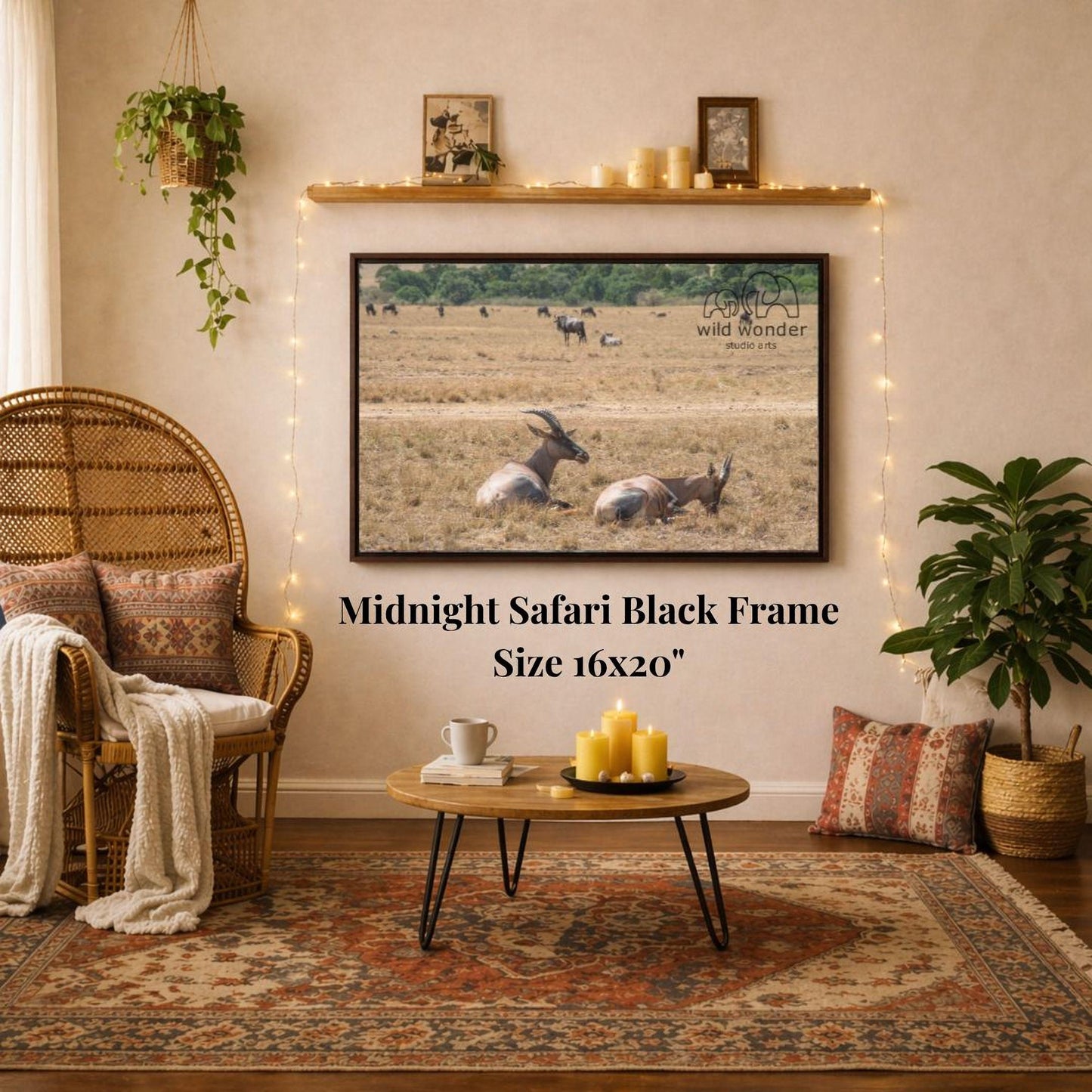 a living room with a large framed photograph of a group of animals, likely zebras, hanging on the wall. The photograph is mounted on a black frame, and the text "Midnight Safari Black Frame" is displayed below it. The room also includes a wicker chair, a coffee table, and various decorative elements such as a potted plant and a vase.