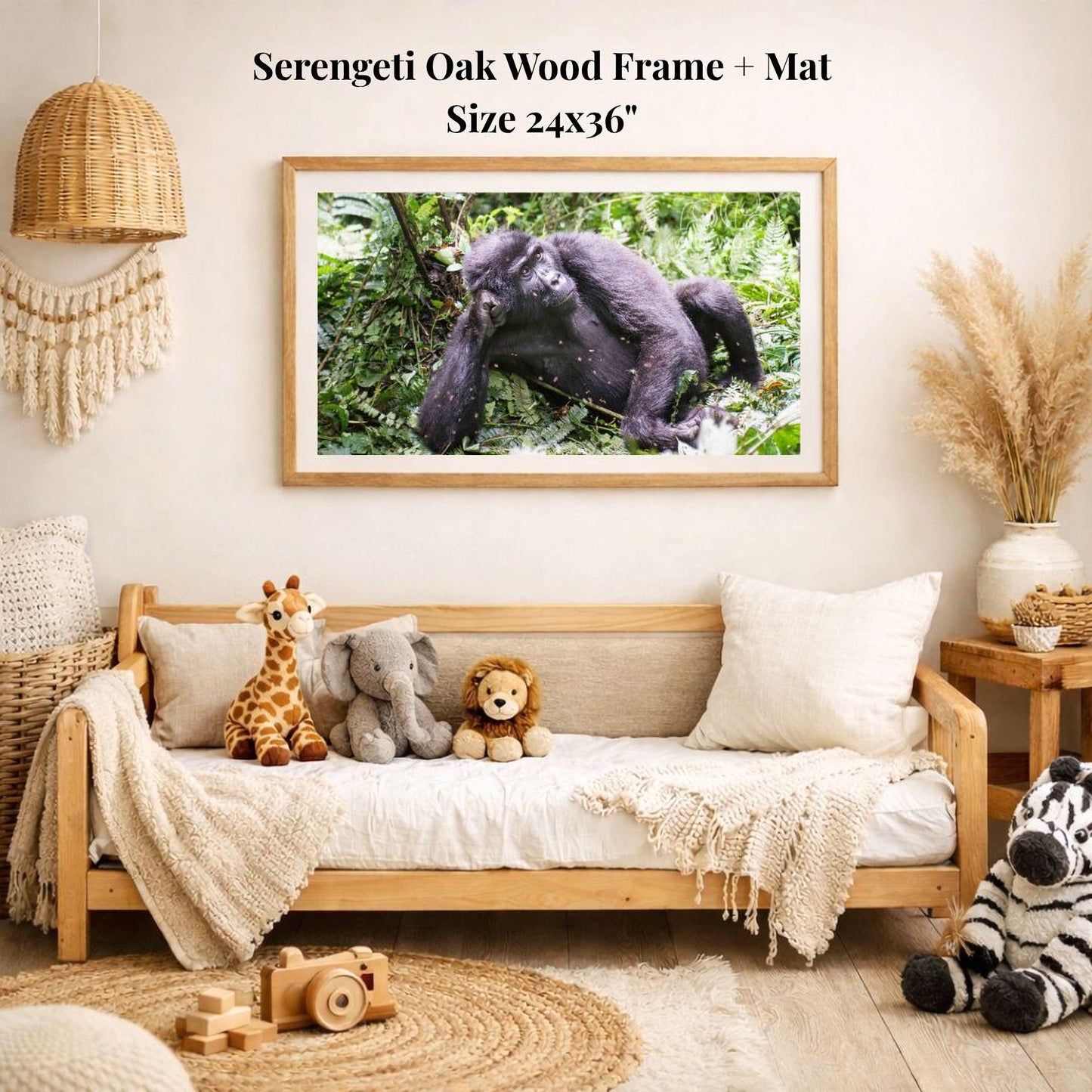 a serene indoor setting with a wooden frame and mat hanging on a wall, displaying a photograph of a gorilla in a lush green forest. The room is decorated with various stuffed animals, including a giraffe, elephant, lion, and zebra, arranged on a couch and a rug.