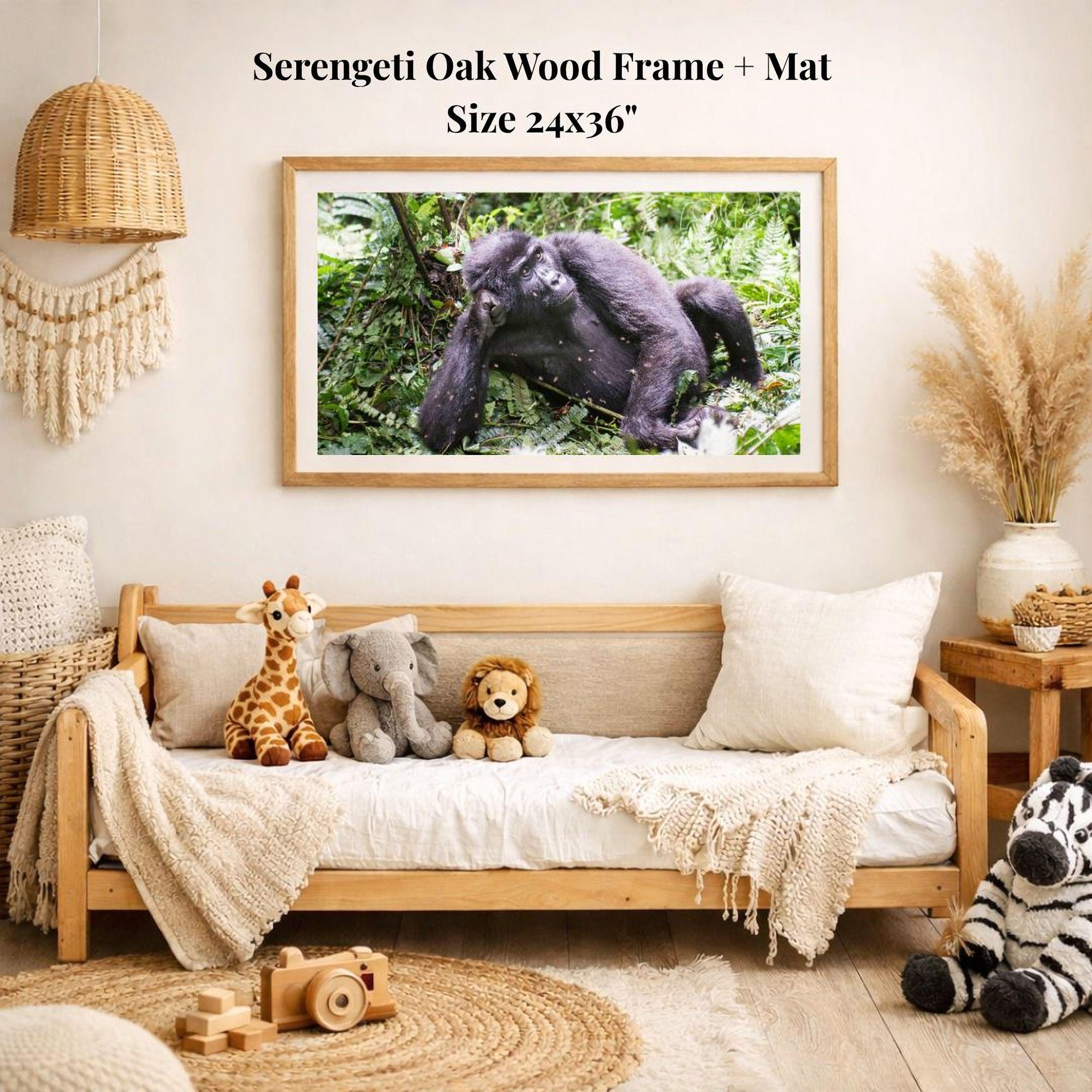 a serene indoor setting with a wooden frame and mat hanging on a wall, displaying a photograph of a gorilla in a lush green forest. The room is decorated with various stuffed animals, including a giraffe, elephant, lion, and zebra, arranged on a couch and a rug.