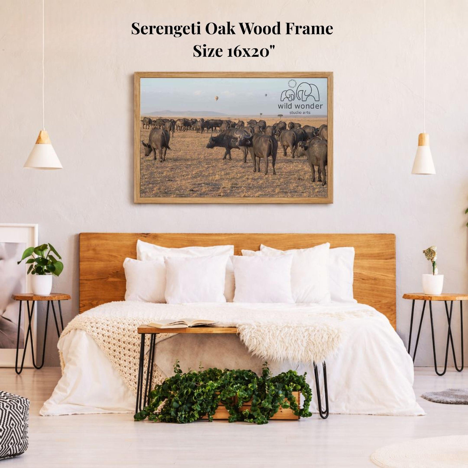 a serene bedroom scene with a large framed picture of a herd of elephants in the background, hanging on the wall above a bed with white bedding.