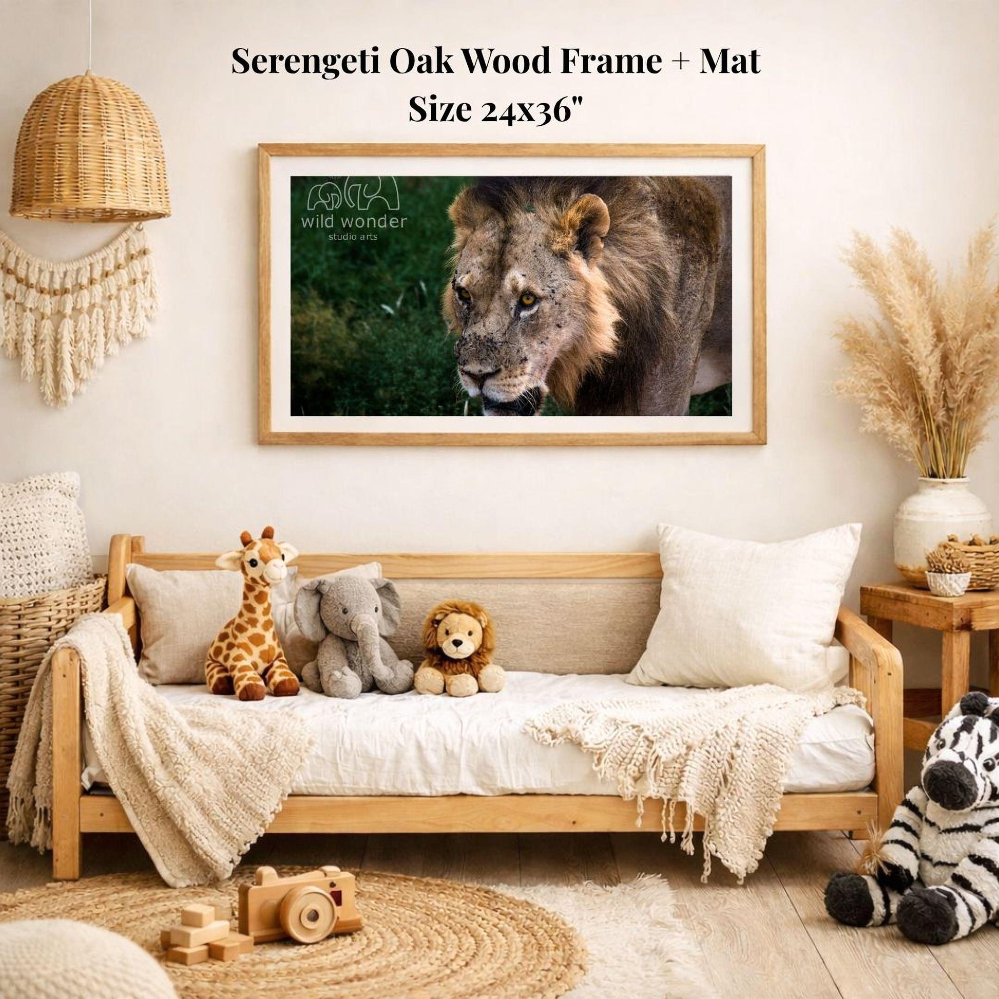 a serene indoor setting with a wooden frame and mat hanging on a wall, displaying a photograph of a lion. The frame is surrounded by various stuffed animals, including a giraffe, an elephant, and a lion, creating a cozy and playful atmosphere.