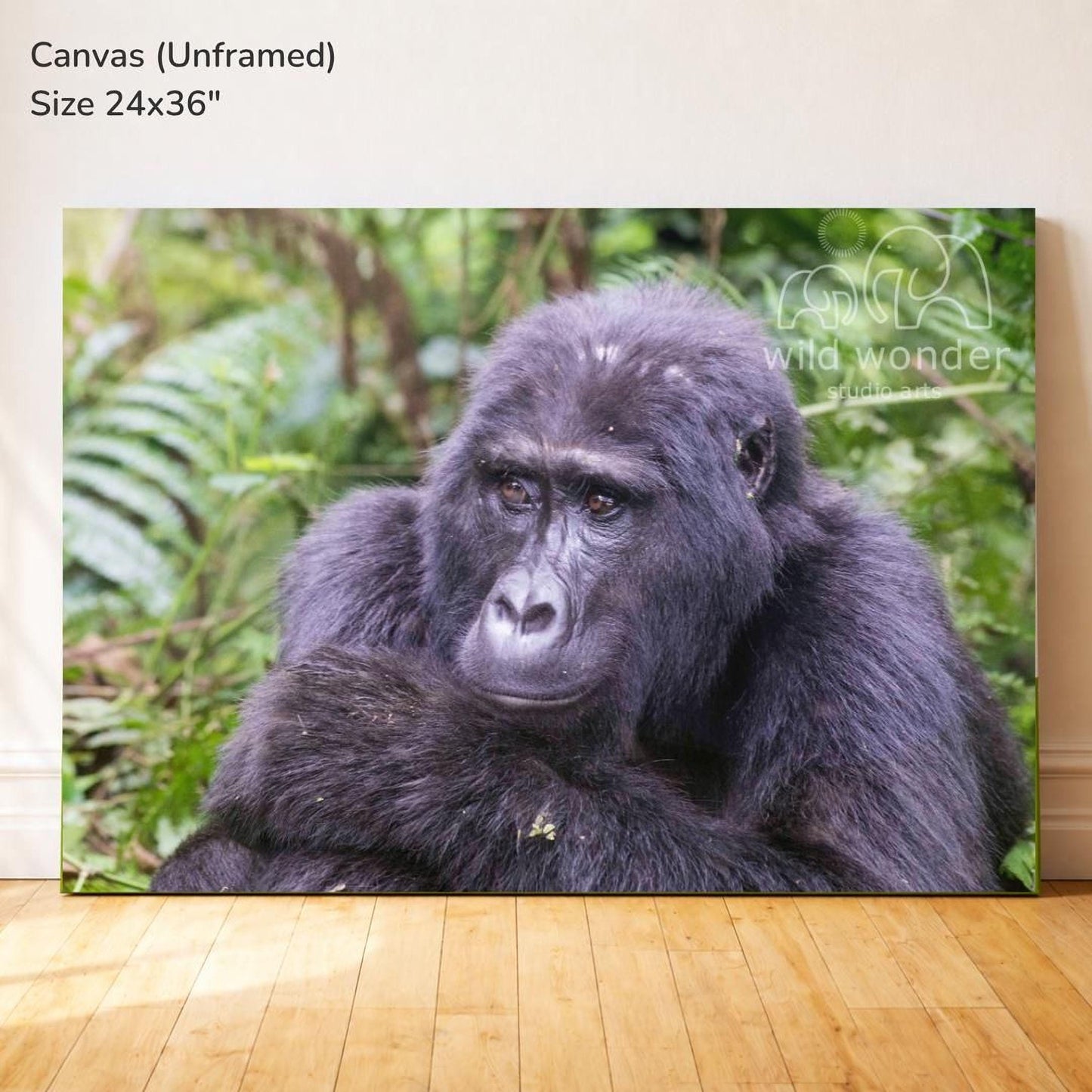 A close-up portrait of a gorilla sitting in a lush, green forest environment.
