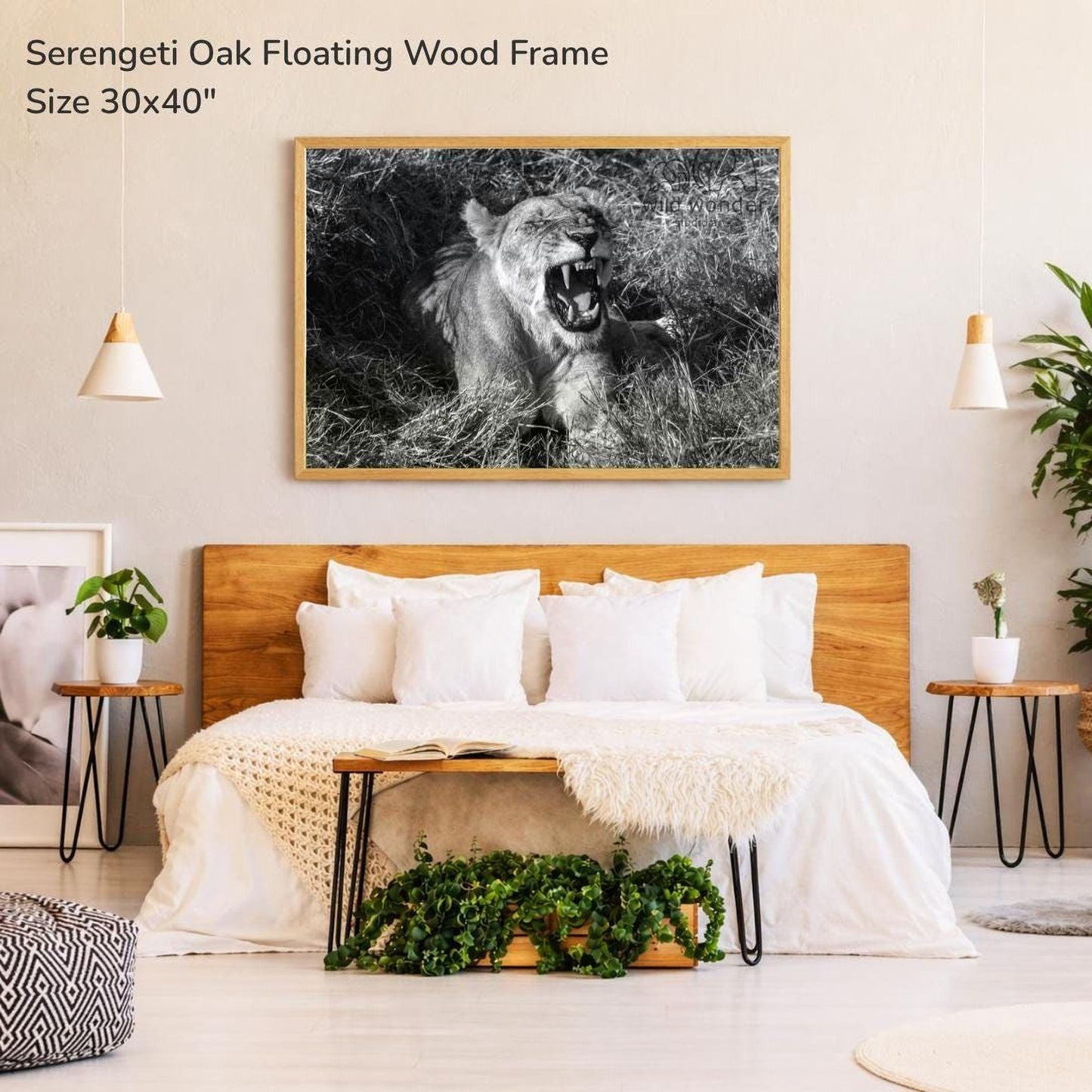 a bedroom with a large bed, a wooden headboard, and a framed photograph of a lion on the wall above the bed.