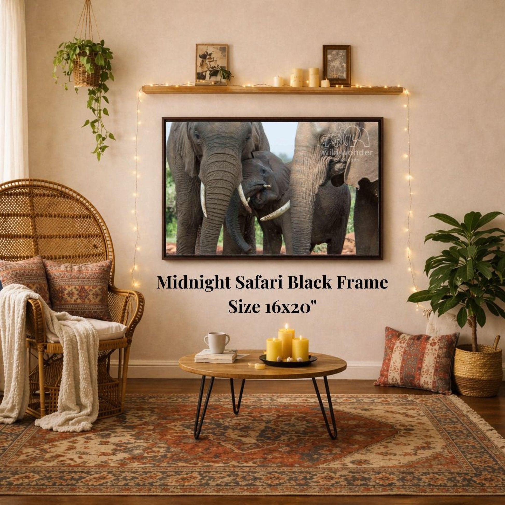 a living room with a large framed photograph of three elephants on the wall, a wicker chair, a coffee table, and a potted plant.