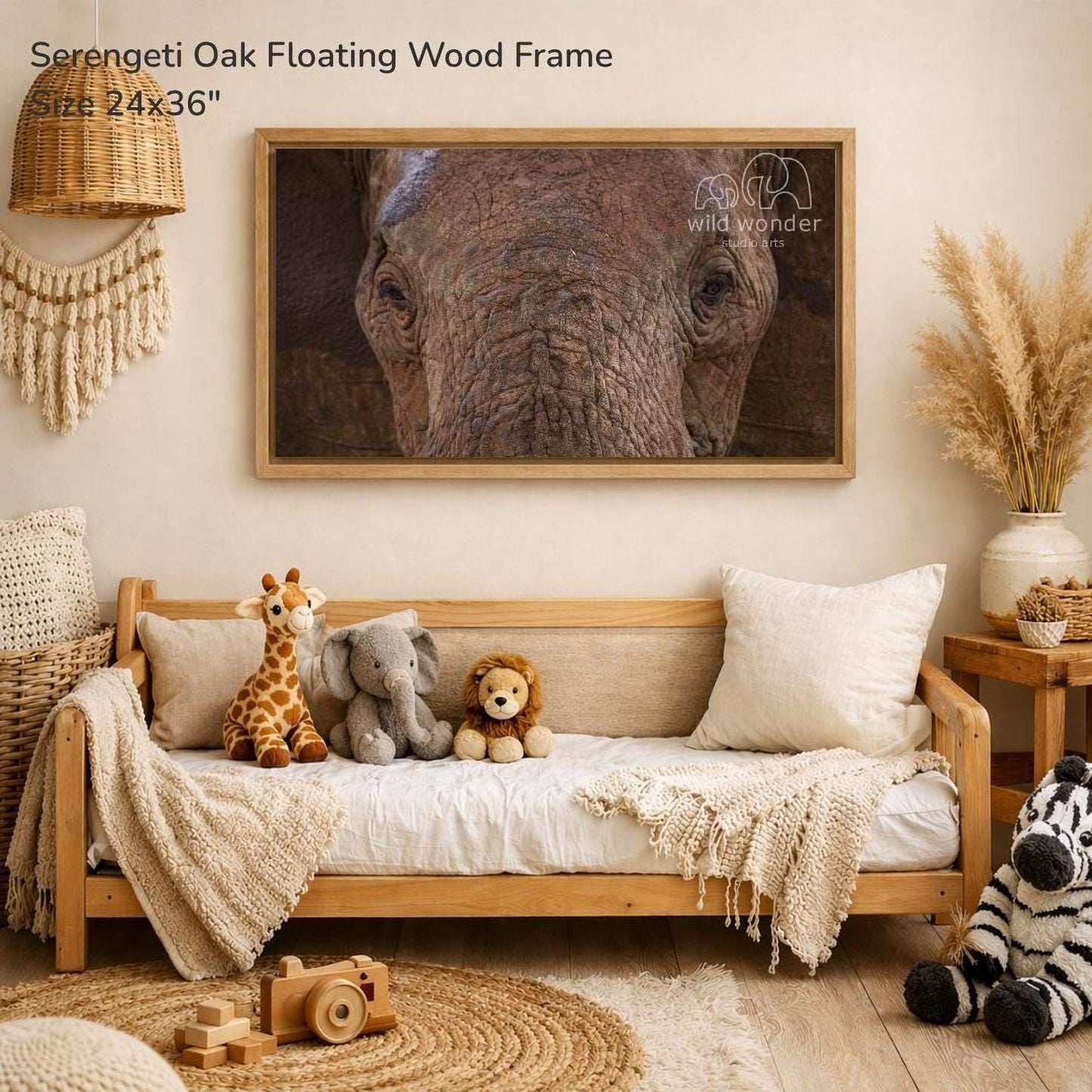 a serene and cozy living room with a large wooden frame hanging on the wall, displaying a close-up of an elephant's face. The room is decorated with various stuffed animals, including a giraffe, an elephant, and a lion, arranged on a couch and a bed. The room also includes a potted plant, a vase, and a wooden toy car, creating a warm and inviting atmosphere.
