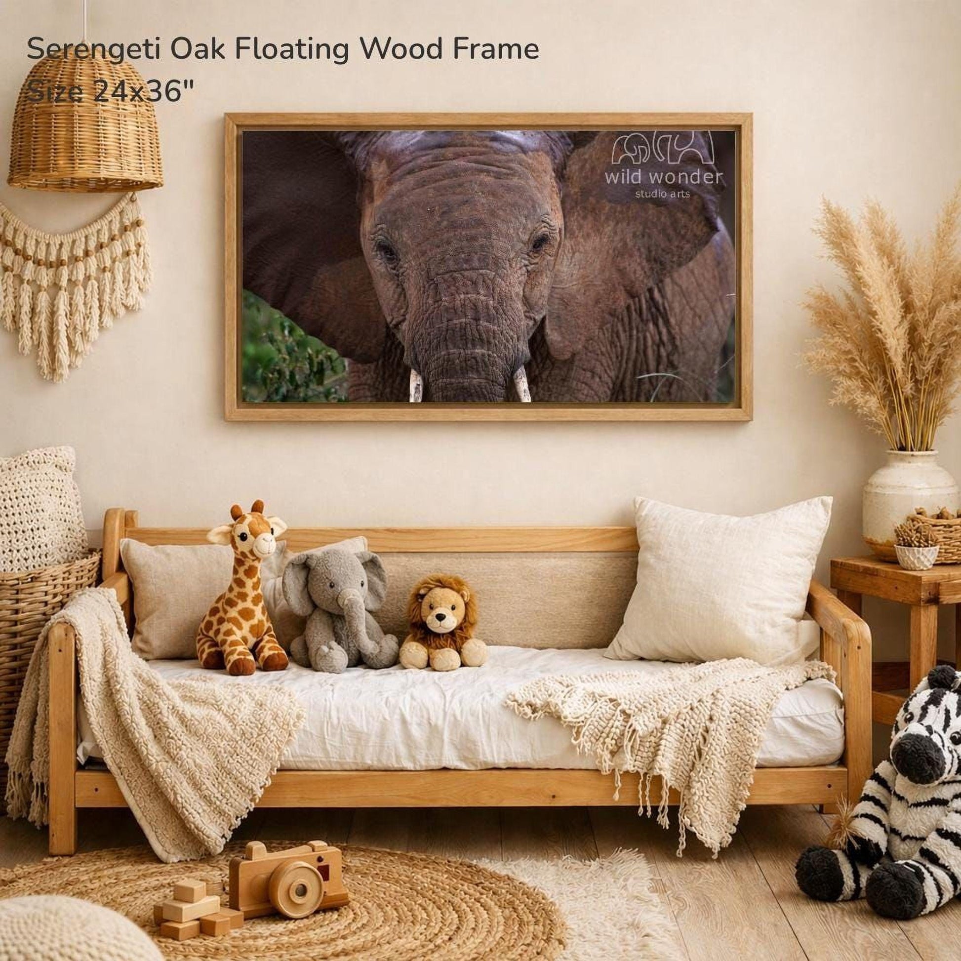 a serene indoor setting with a wooden frame hanging on a wall, displaying a close-up of an elephant. The frame is surrounded by various stuffed animals, including a giraffe, an elephant, and a lion, creating a cozy and playful atmosphere.