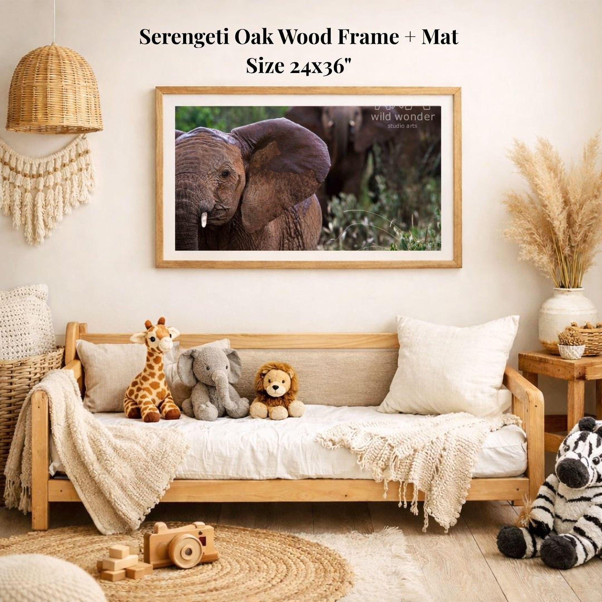 a serene indoor setting with a wooden frame and mat hanging on a wall, displaying a photograph of two elephants. The room is decorated with various items, including a woven basket, a wooden chair, a stuffed giraffe, a stuffed lion, and a stuffed zebra.