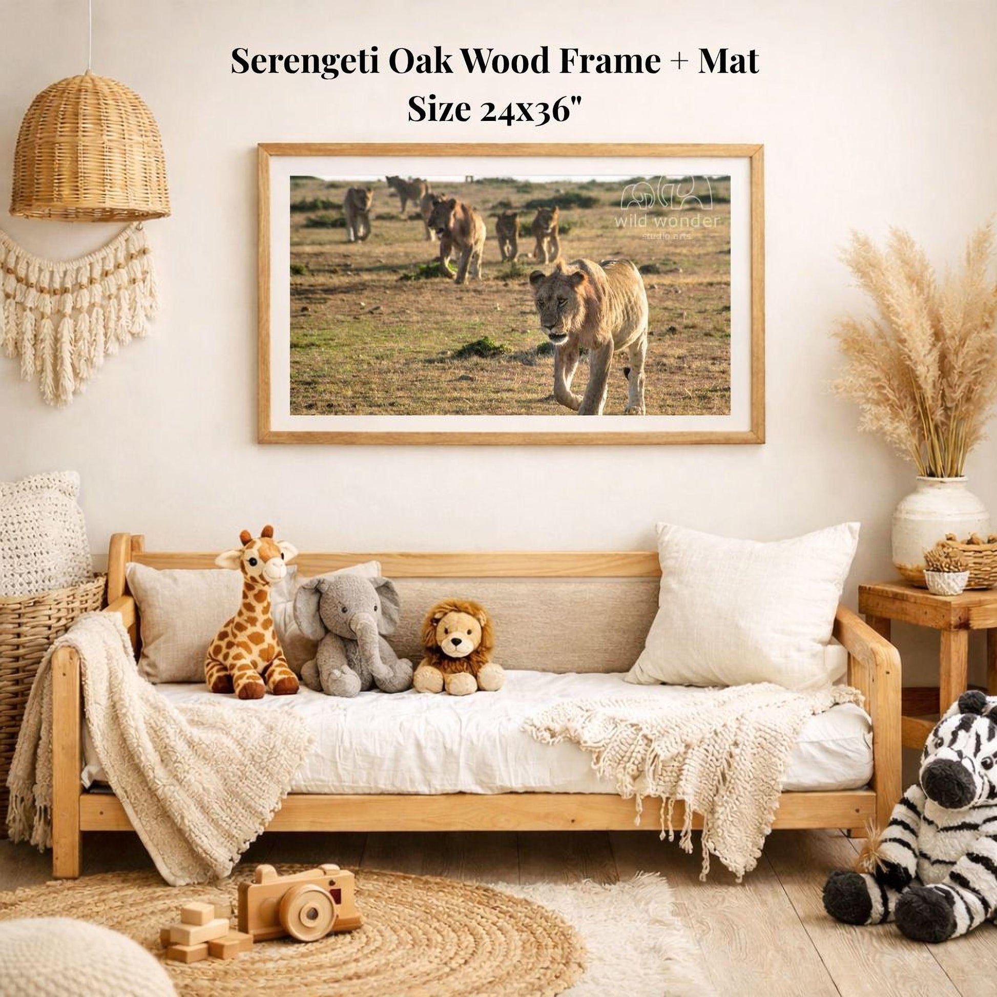 a serene indoor setting with a wooden frame and mat hanging on the wall, displaying a photograph of a group of lions in a grassy field. The room is decorated with various items, including a wooden bench, a woven basket, a stuffed giraffe, a stuffed lion, and a stuffed zebra.