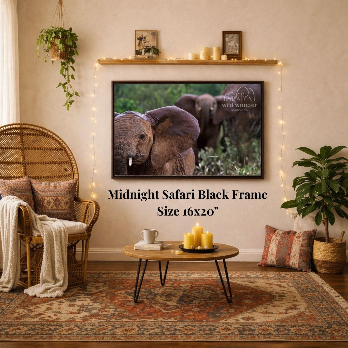 a living room with a large framed photograph of two elephants hanging on the wall. The photograph is in a black frame and is the focal point of the room. The room is decorated with various items, including a wicker chair, a coffee table, and a potted plant. The overall atmosphere of the room appears to be cozy and inviting.