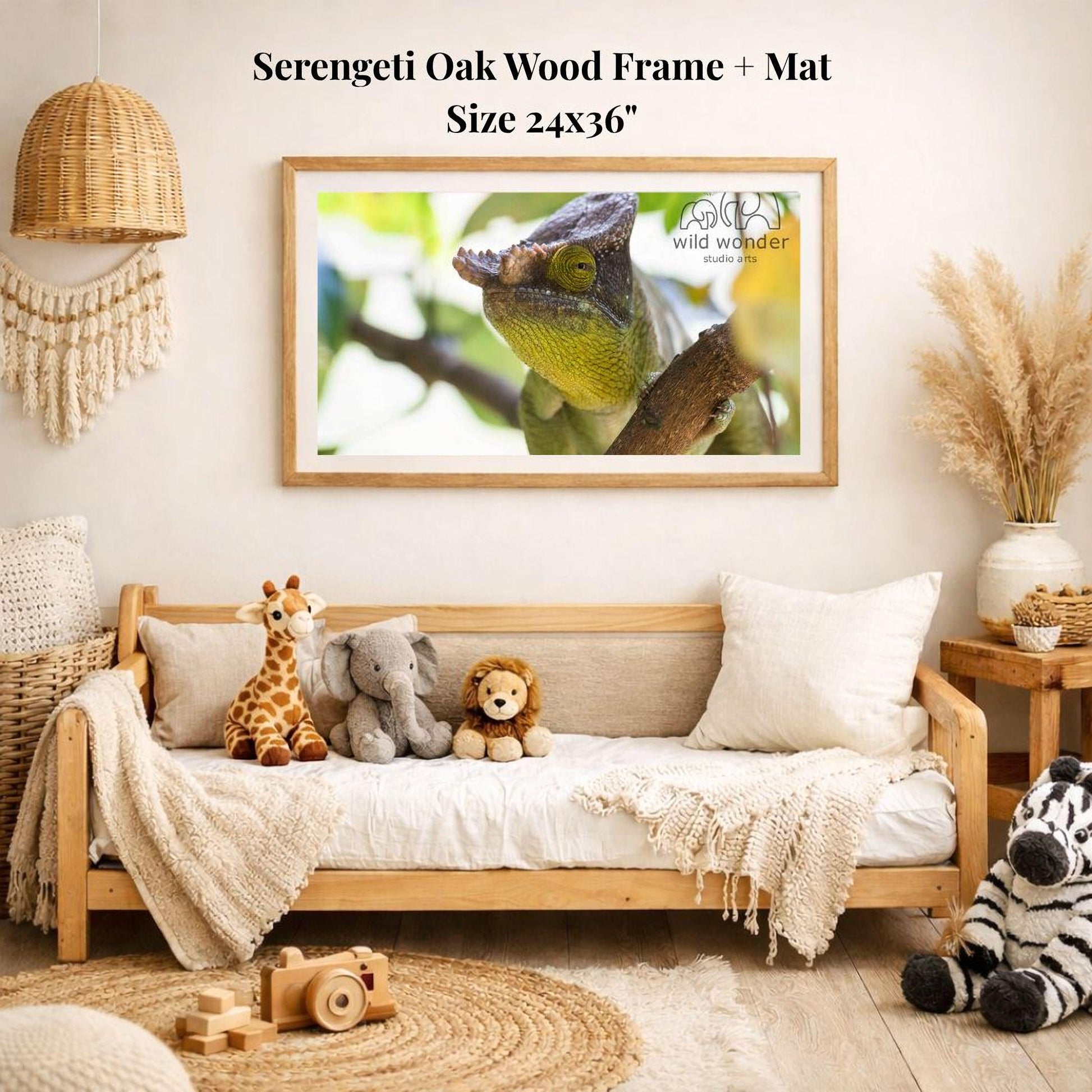 a cozy living room with a wooden frame and mat hanging on the wall, displaying a framed photograph of a chameleon. The room is decorated with various stuffed animals, including a giraffe, elephant, lion, and zebra, arranged on a couch and a rug. The overall atmosphere of the room appears warm and inviting, with a focus on nature and wildlife.
