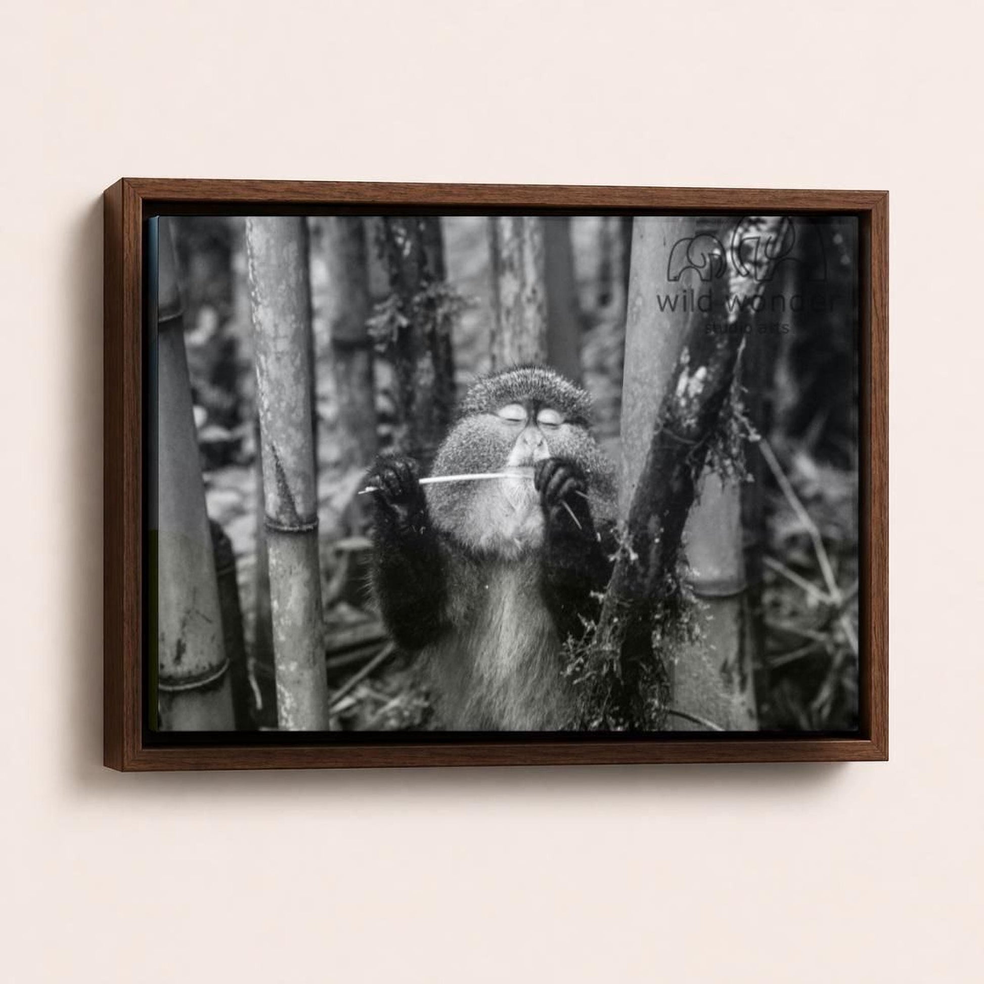 A monkey is standing in a forest, holding a stick in its hands.