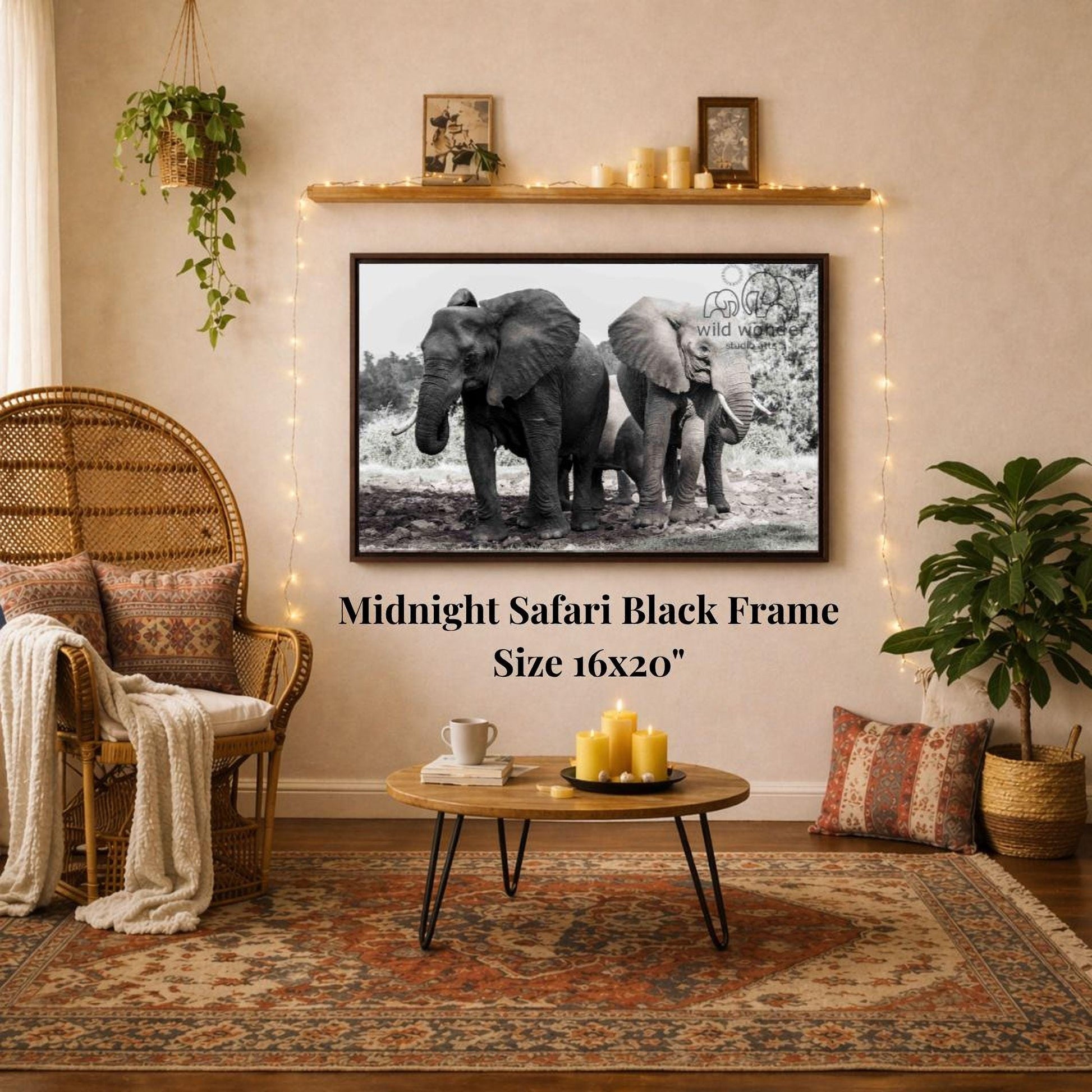a living room with a large black and white photograph of two elephants on the wall, a wicker chair, a coffee table, and a potted plant.