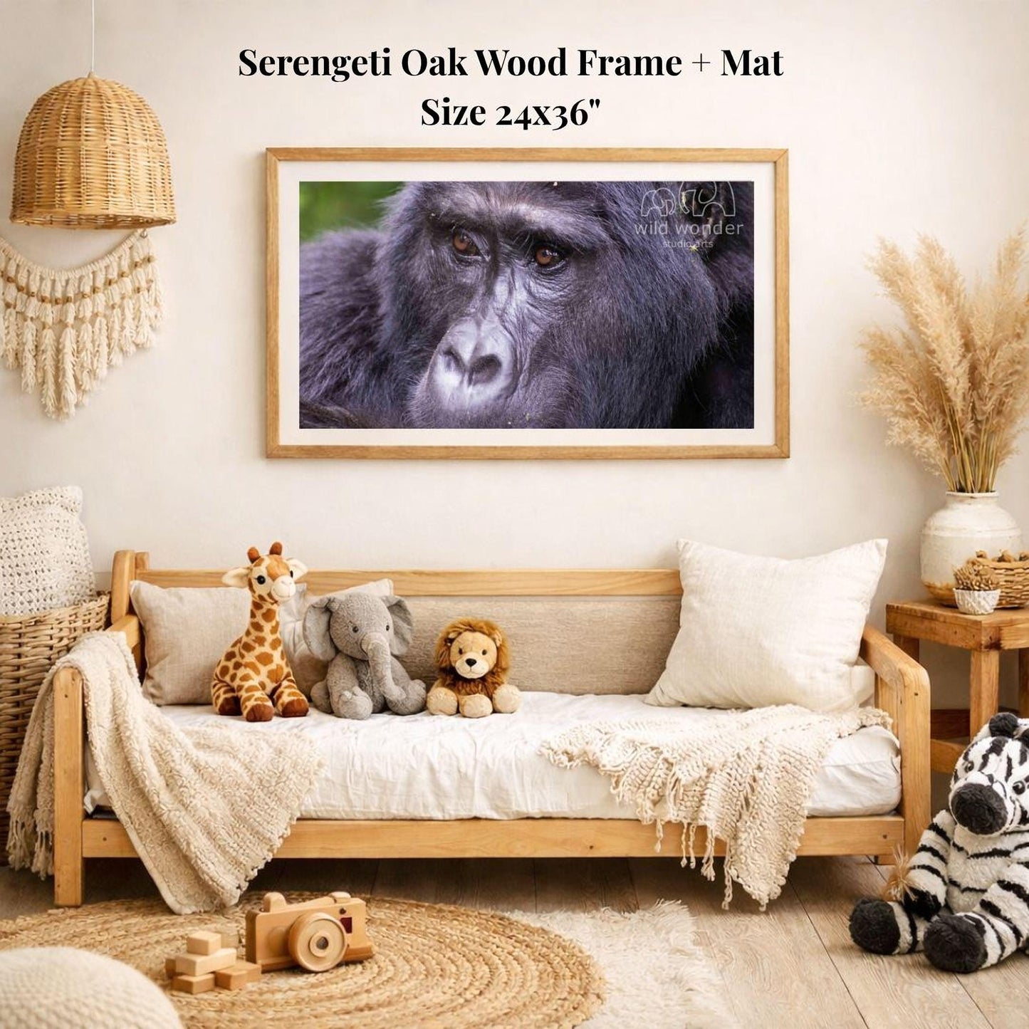 a serene indoor setting with a wooden frame and mat hanging on the wall, above a comfortable couch with stuffed animals.