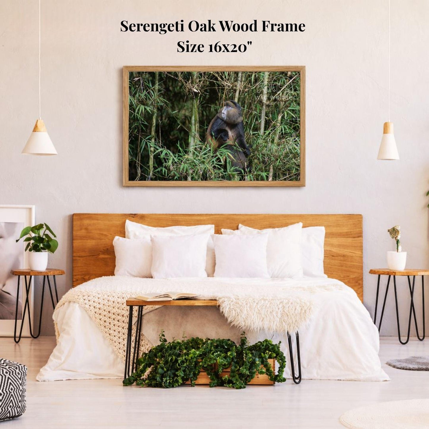 a serene bedroom setting with a large, 16x20" framed photograph of a serene oak wood frame hanging on the wall above a bed with white bedding.