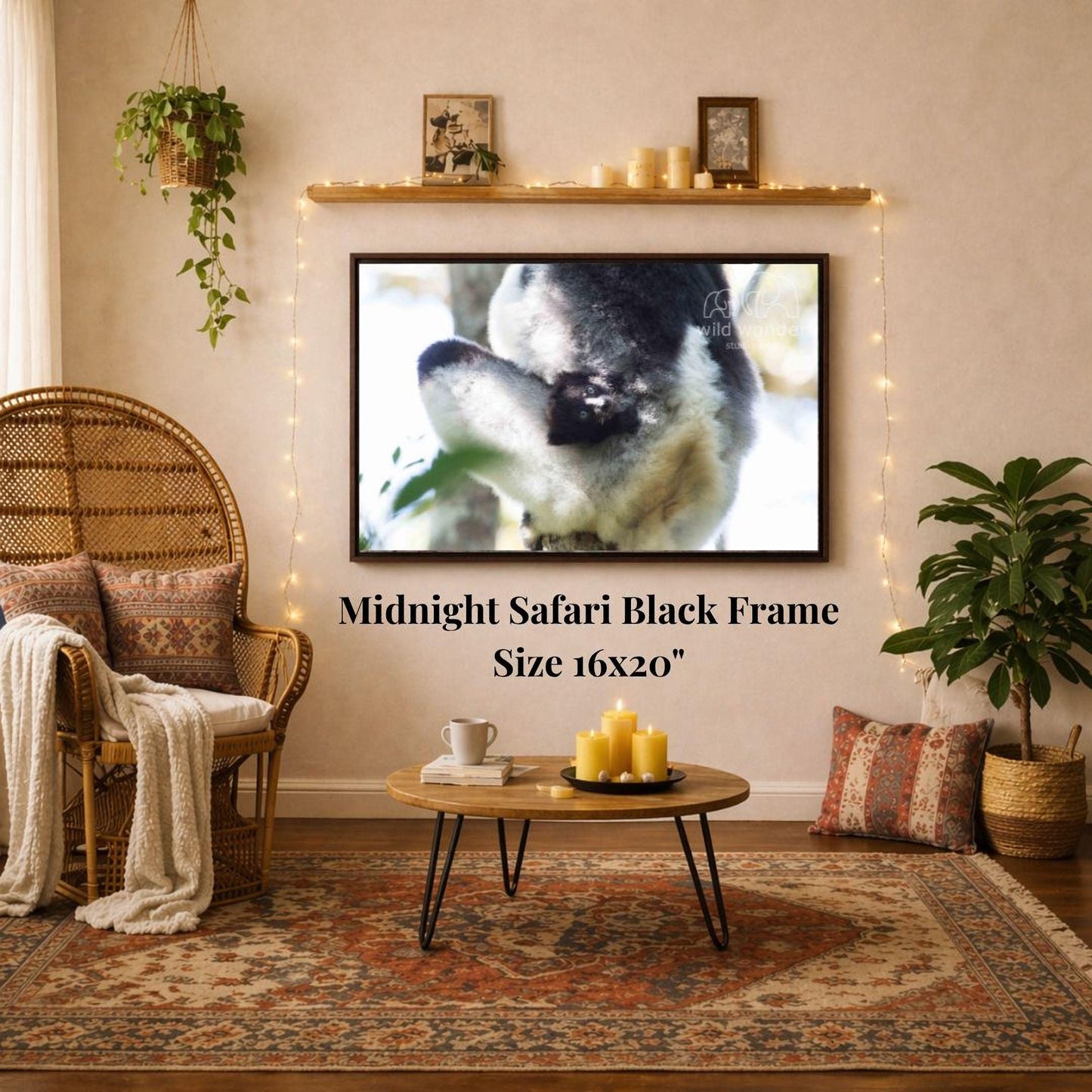 a cozy living room with a large framed picture of a black and white animal, likely a cat, hanging on the wall above a coffee table. The coffee table has a tray with candles and a book on it. The room also features a wicker chair, a potted plant, and a woven basket, creating a warm and inviting atmosphere.
