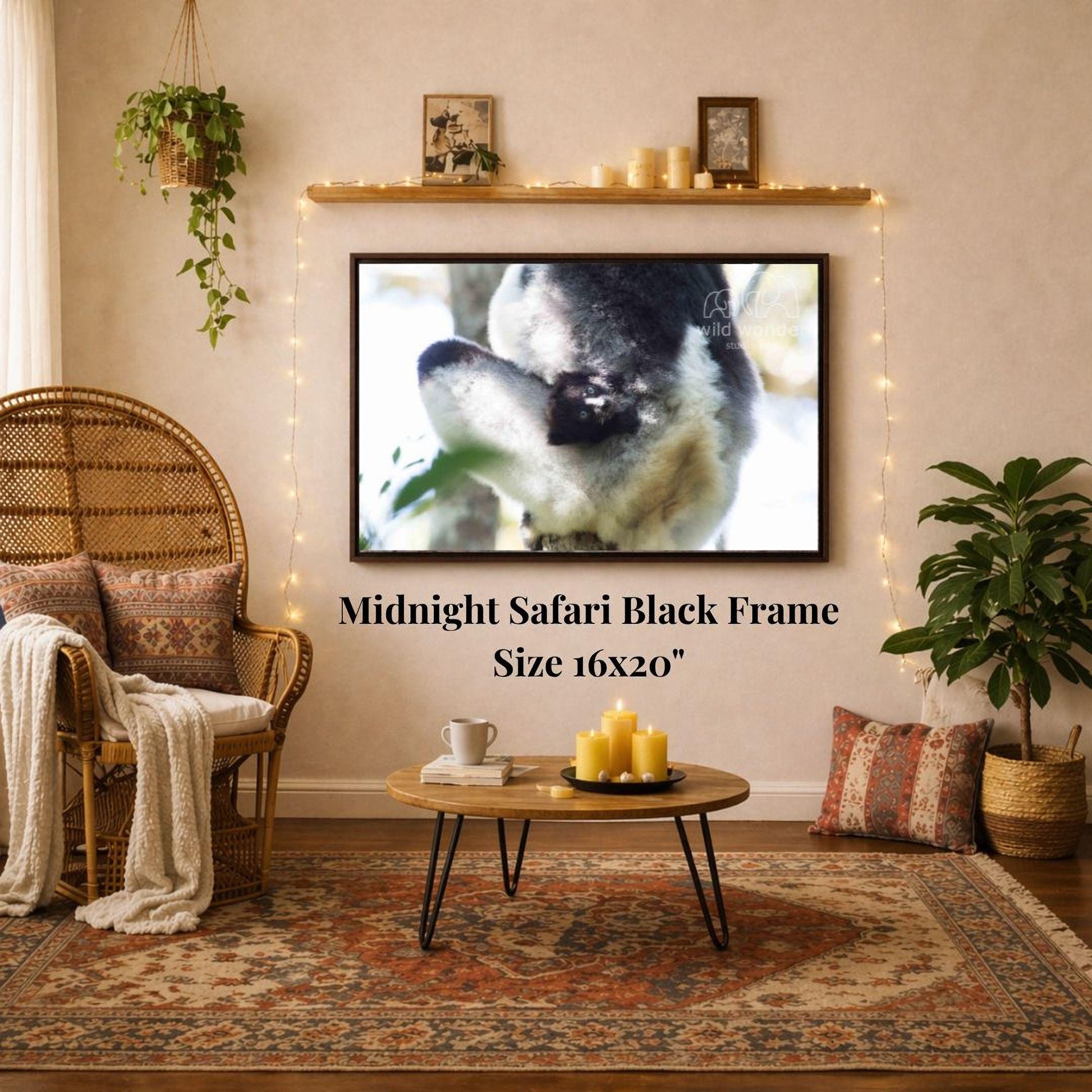 a cozy living room with a large framed picture of a black and white animal, likely a cat, hanging on the wall above a coffee table. The coffee table has a tray with candles and a book on it. The room also features a wicker chair, a potted plant, and a woven basket, creating a warm and inviting atmosphere.