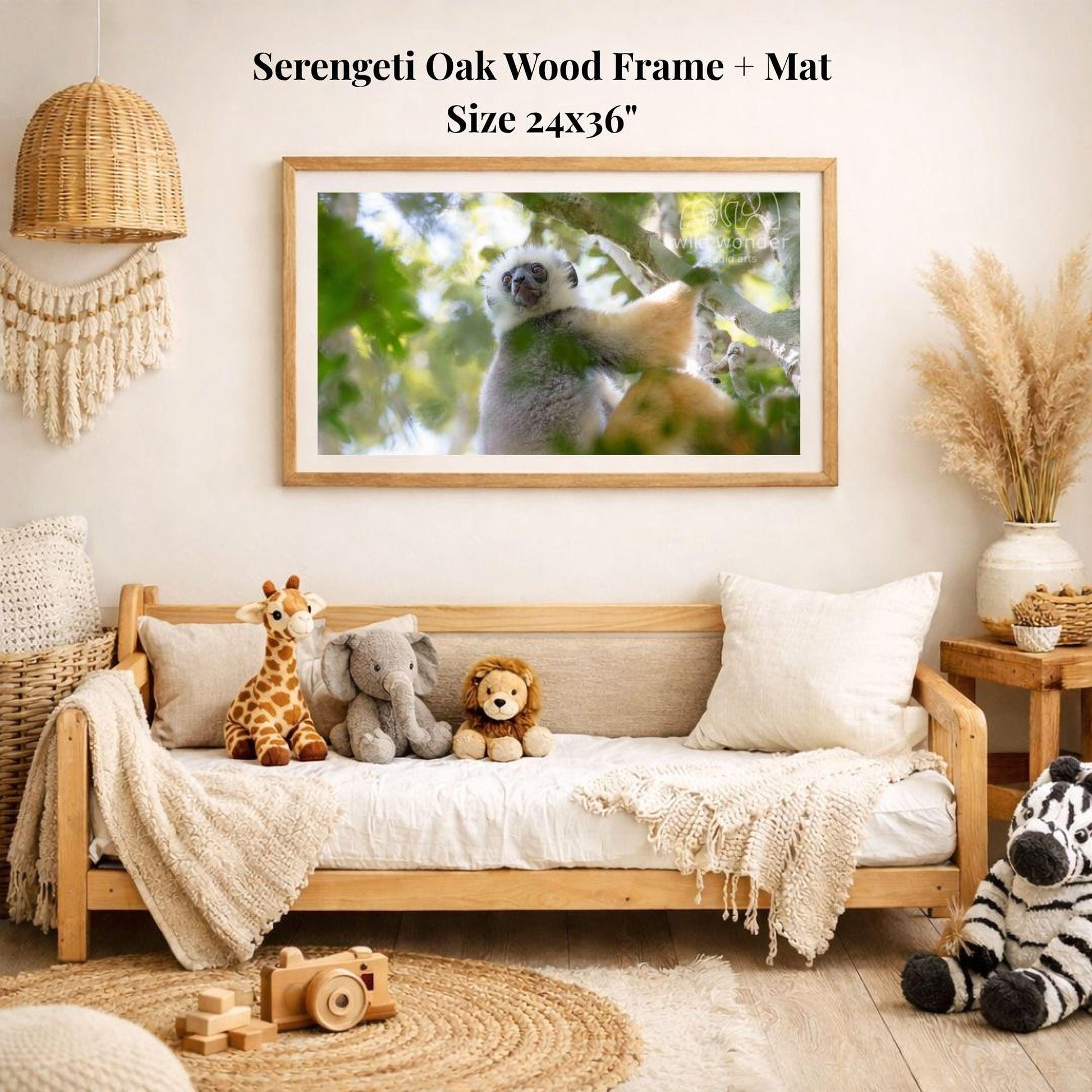 a serene indoor setting with a wooden frame and mat hanging on a wall, displaying a photograph of a lemur in a tree. The room is decorated with various stuffed animals, including a giraffe, elephant, lion, and zebra, arranged on a couch and a rug. The overall atmosphere of the room is cozy and inviting, with a harmonious blend of natural and playful elements.