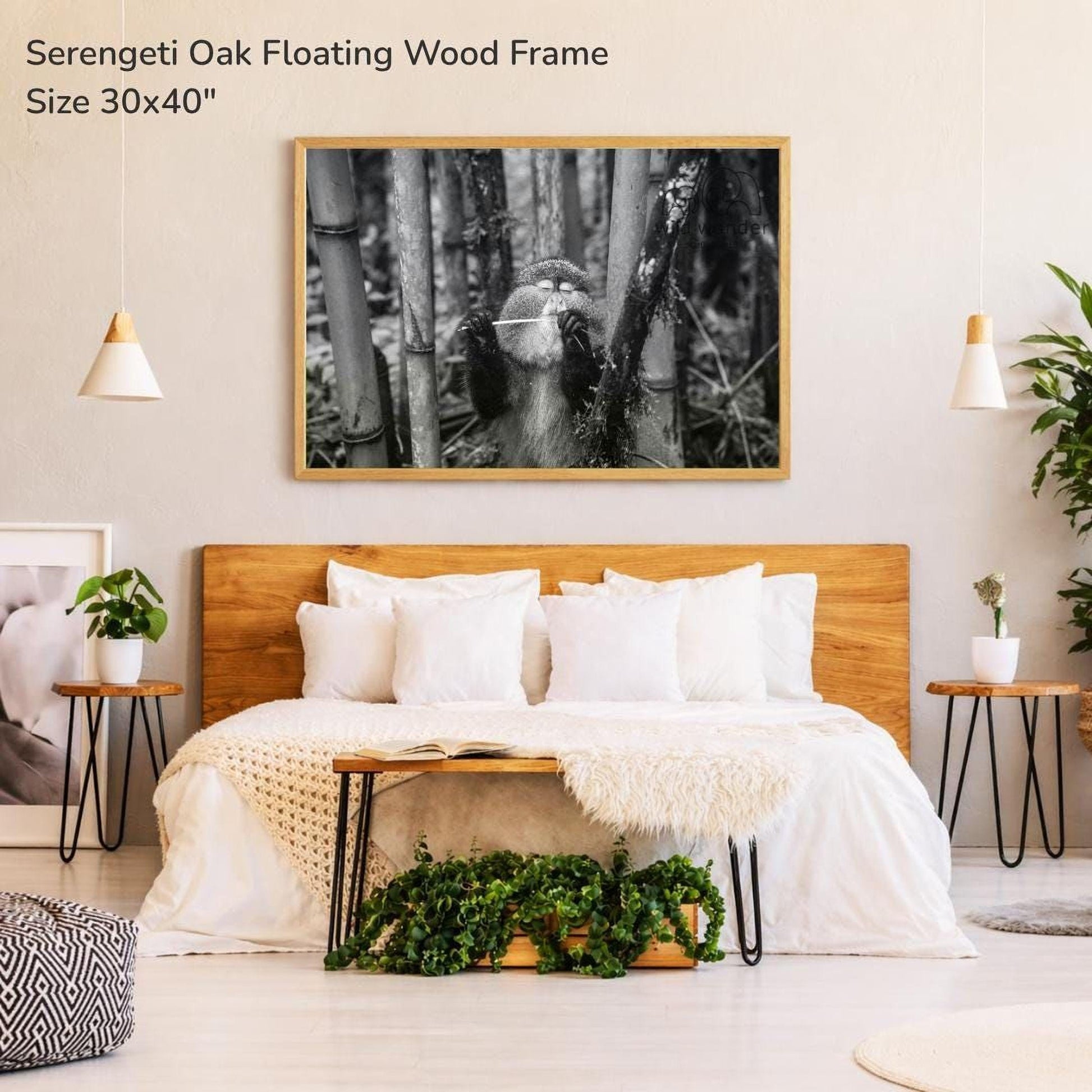 a serene bedroom setting with a large bed, a wooden headboard, and a framed photograph of a seagull perched on a tree branch hanging above it. The room is decorated with potted plants and other natural elements, creating a calming and relaxing atmosphere.