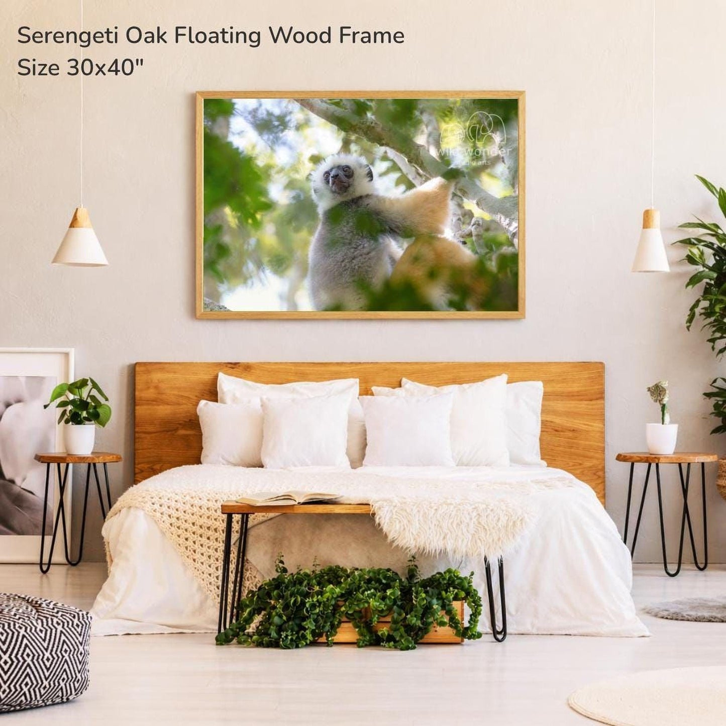 a serene bedroom setting with a large wooden headboard, a cozy bed with white bedding, and a framed photograph of a lemur hanging on the wall above it.