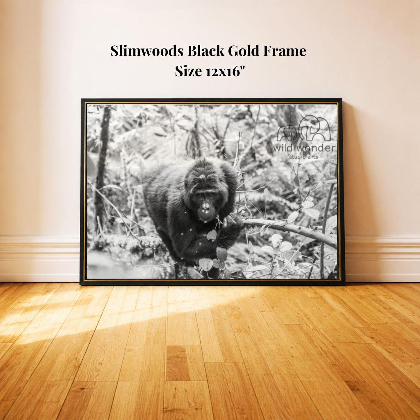 A black and white photograph of a monkey in a forest setting, with a black frame.