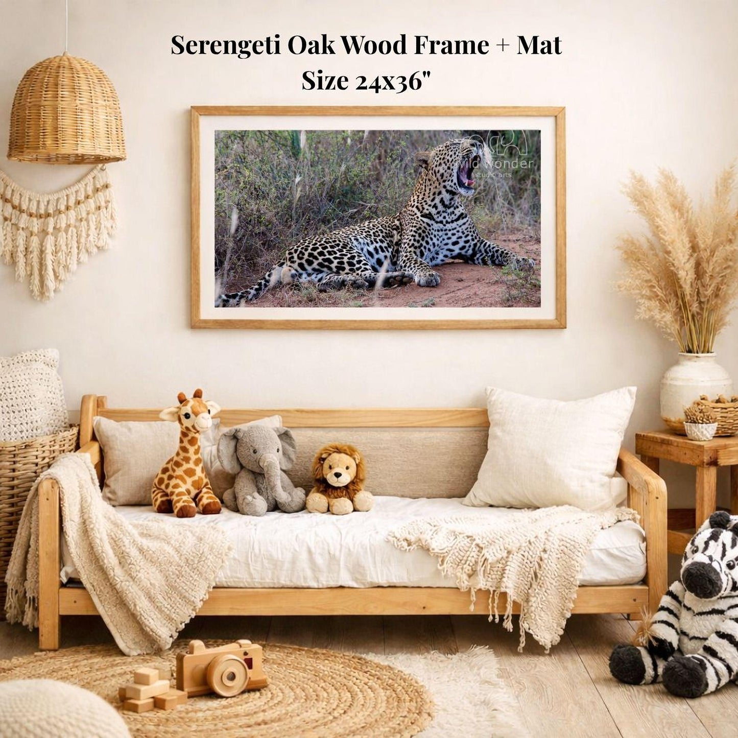 a serene indoor setting with a framed photograph of a leopard resting on the wall, surrounded by various stuffed animals and a woven basket.