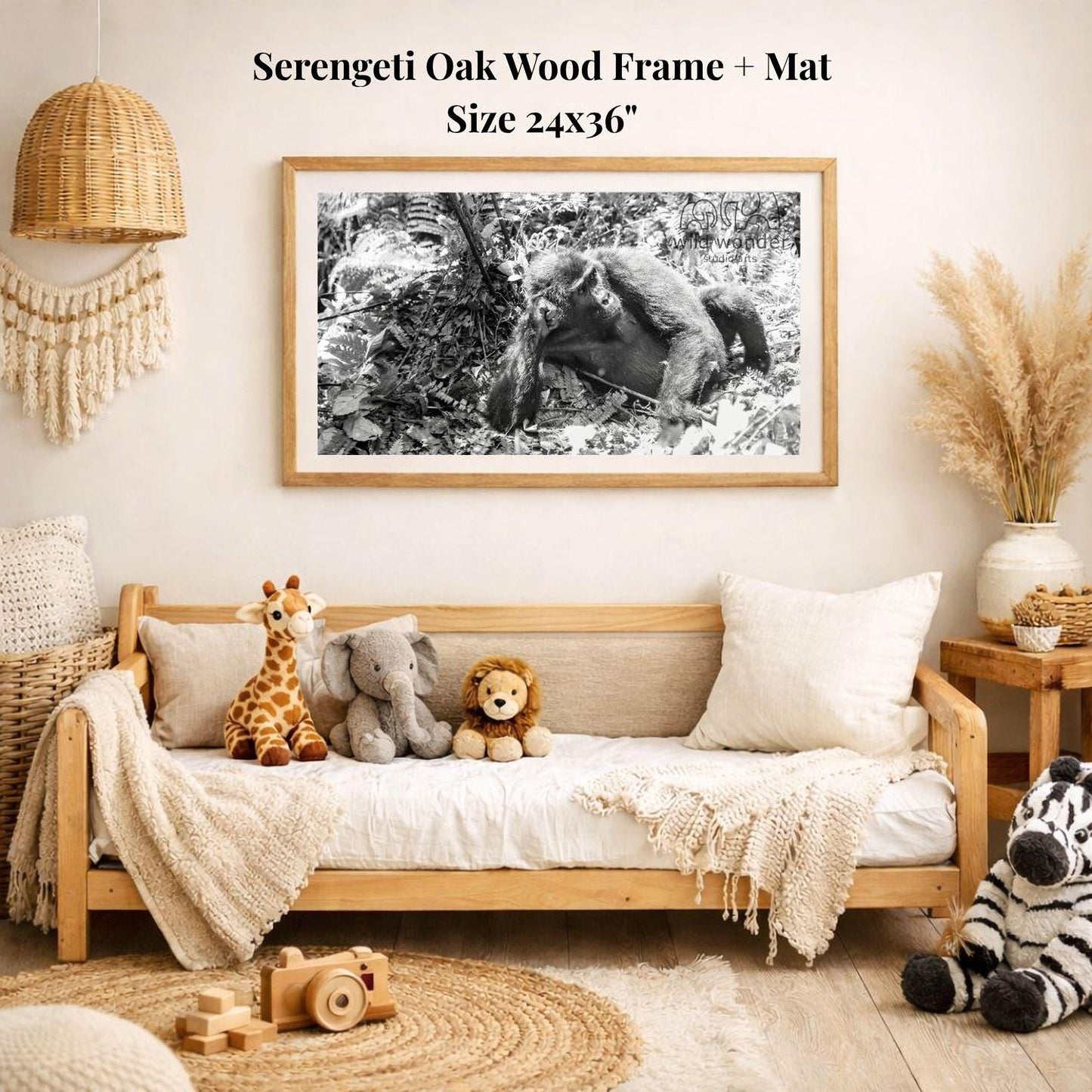 a cozy living room with a wooden sofa, a framed black and white photograph of a bear and a giraffe, and various stuffed animals on the sofa.