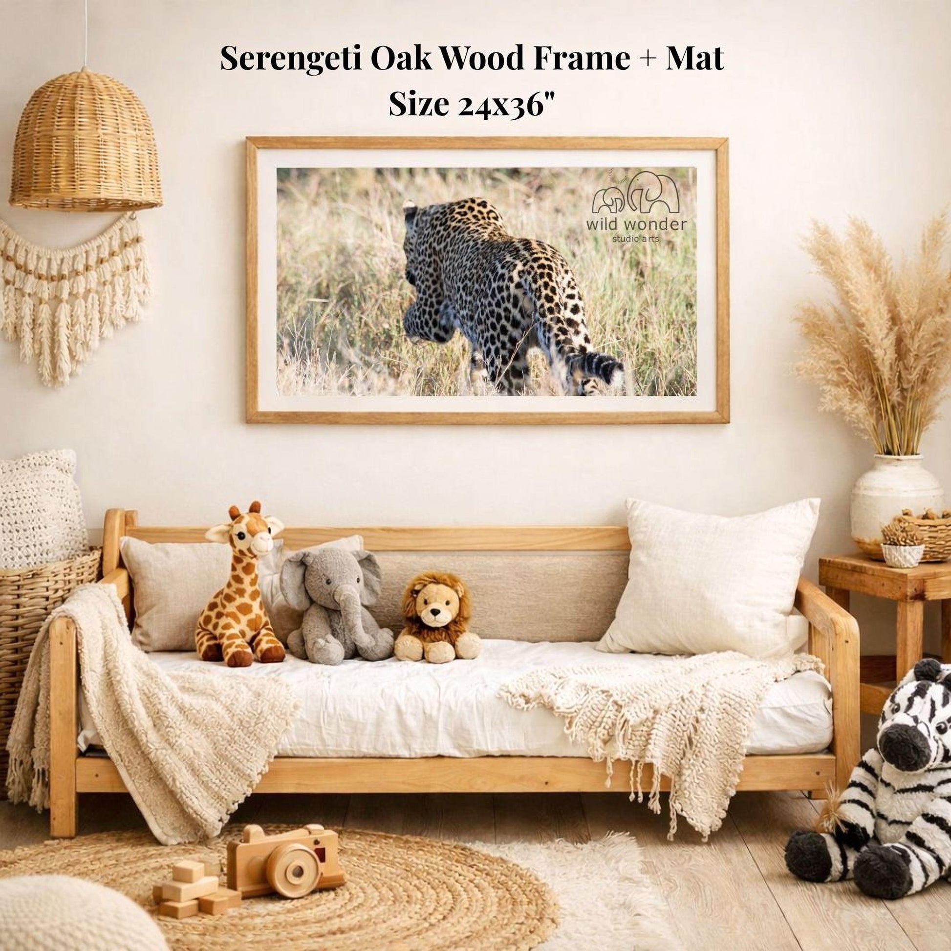 a serene indoor setting with a wooden frame and mat hanging on the wall, displaying a photograph of a leopard in the wild. The frame is surrounded by various stuffed animals, including a giraffe, an elephant, and a lion, creating a cozy and playful atmosphere.