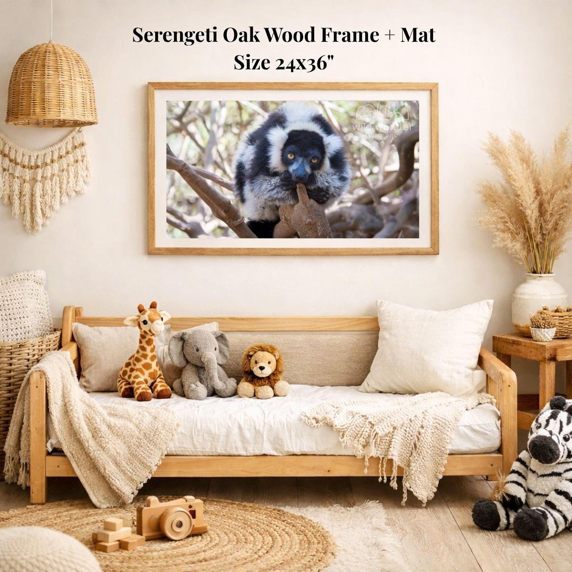a serene indoor setting with a wooden frame and mat hanging on the wall, displaying a photograph of a lemur. The room is decorated with various stuffed animals, including a giraffe, elephant, lion, and zebra, arranged on a couch and a rug. The overall scene conveys a sense of warmth and comfort, with the wooden frame and mat adding a touch of rustic charm to the space.