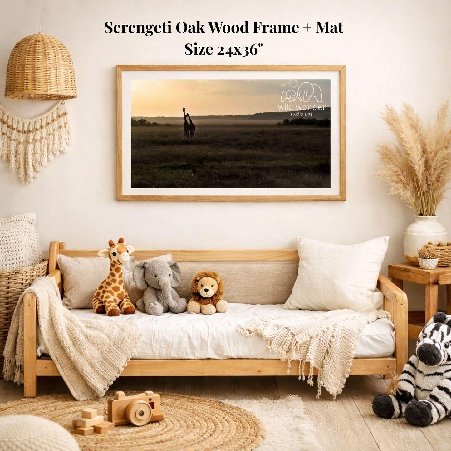 a serene indoor setting with a wooden frame and mat hanging on a wall, displaying a photograph of a serene landscape with a sunset. The frame is surrounded by various stuffed animals, including a giraffe, elephant, lion, and zebra, creating a cozy and playful atmosphere.