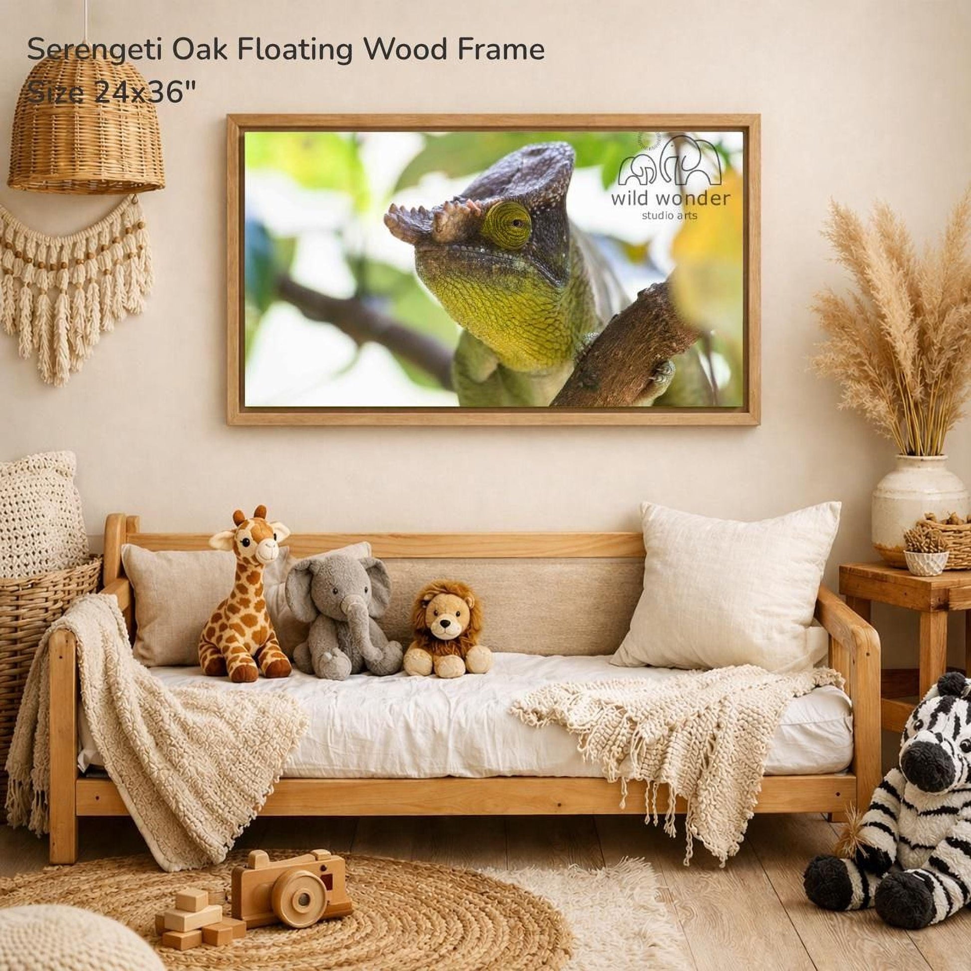 a serene indoor setting with a wooden frame hanging on a wall, displaying a close-up photograph of a chameleon. The frame is surrounded by various stuffed animals, including a giraffe, an elephant, and a lion, creating a cozy and playful atmosphere.