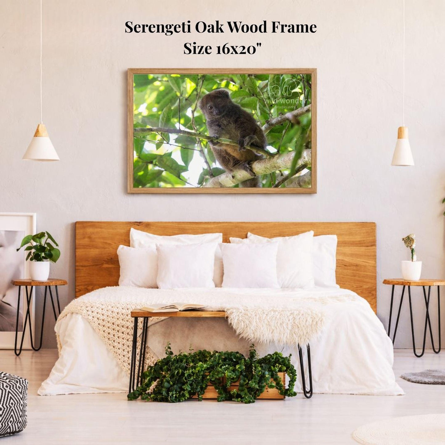 a serene bedroom scene with a large framed photograph of a monkey perched on a branch hanging on the wall above a bed with white bedding.